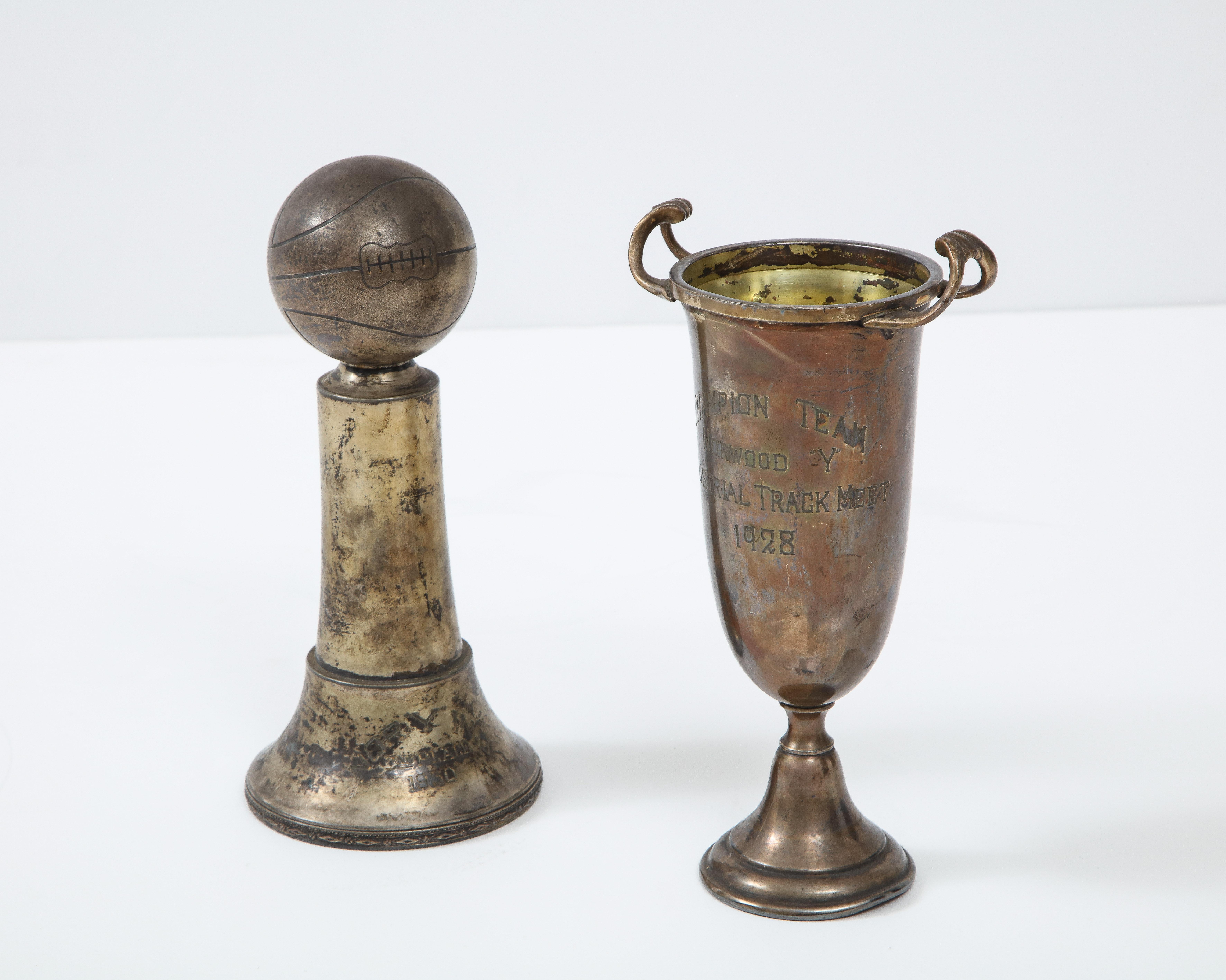 Pair of Art Deco decorative silver-plate sports trophies with aged patina.