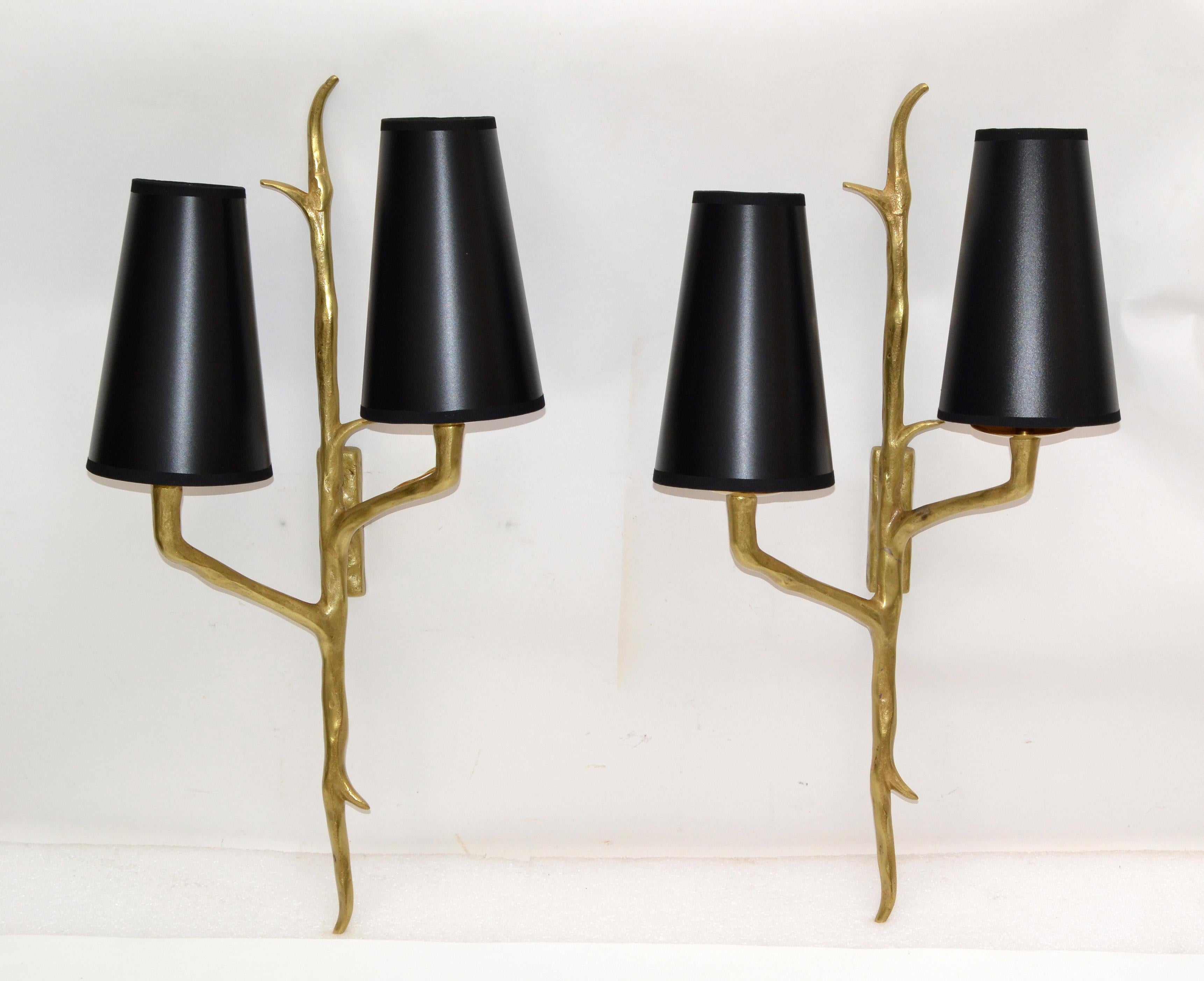 Superb pair of Agostini style bronze sconces with black and gold paper shades.
Each wall sconce takes two-light bulbs with max. 75 watt.
US rewired and in working condition.
Back plate dimension: 4.25 inches high, 1 3/8 inches wide.
Custom