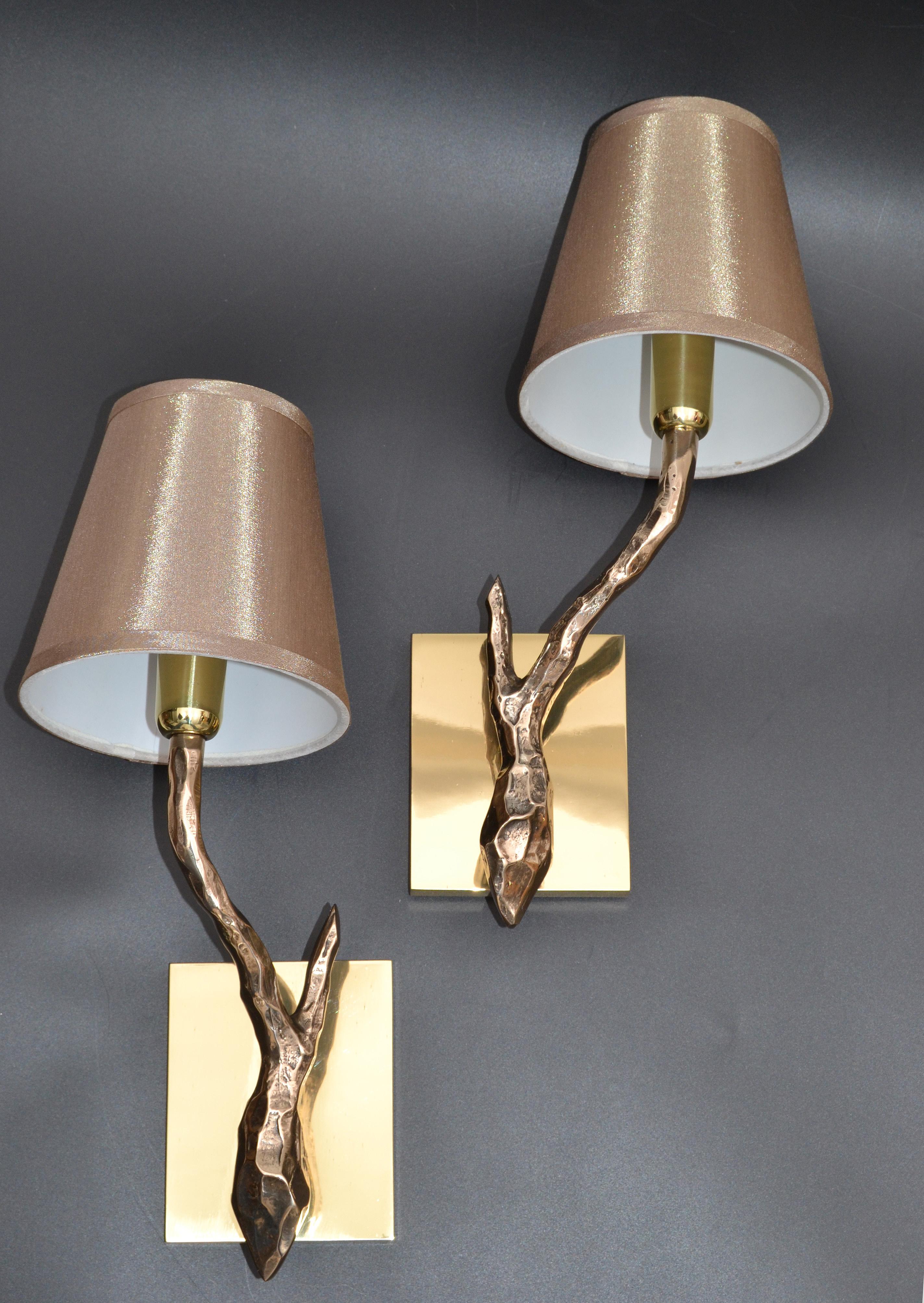 Superb pair of Agostini style bronze sconces with gold metallic fabric and white plastic shades.
Each wall sconce takes one-light bulb with max. 40 watts.
US rewired and in working condition.
Back plate dimension: 5 inches high, 4 inches