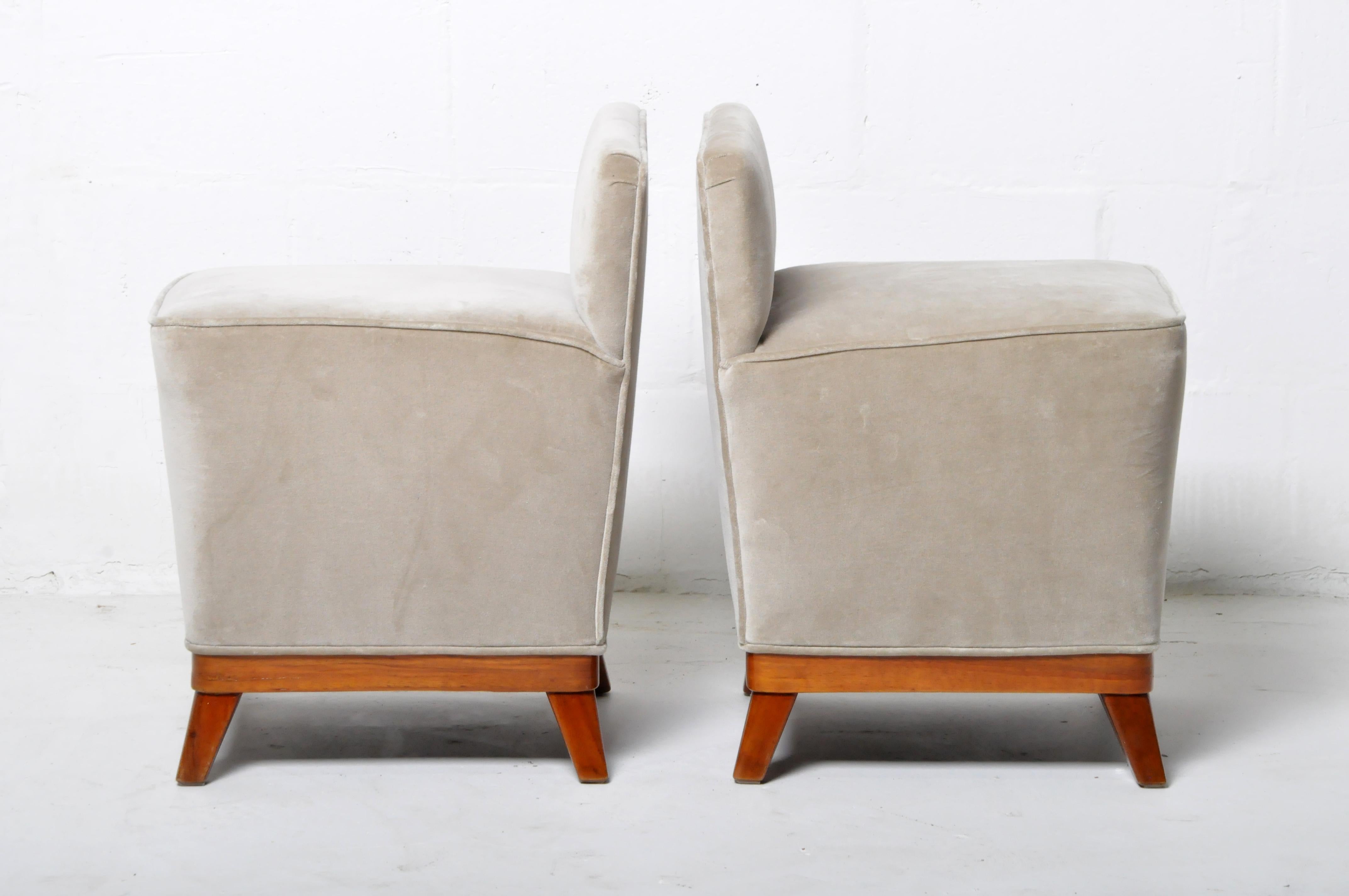This pair of Art Deco stools are from Budapest, Hungary, and they were made from walnut, c. 1940. The upholstery is not original. Wear consistent with age and use. 
  
