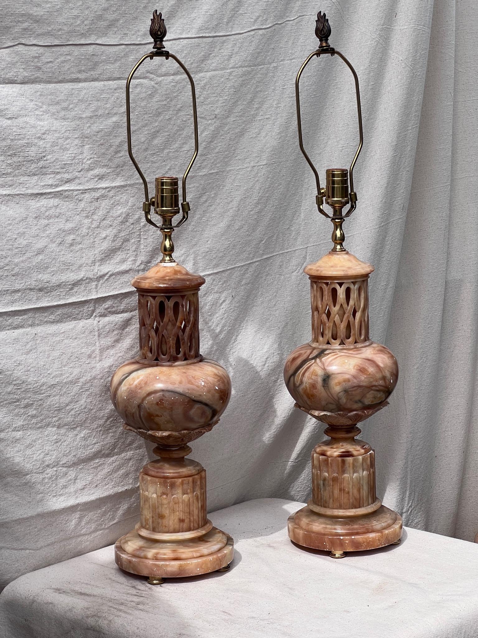 Elevate your space with these exquisite alabaster lamp bases, capturing the charm of the past while adding a touch of timeless beauty to your decor. crafted in the early 20th century, these lamps boast a captivating soft peach hue that closely