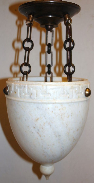 A pair of Italian circa 1930's carved alabaster neoclassic style lanterns with bronze chain. Sold individually.

Measurements:
Height (drop): 16