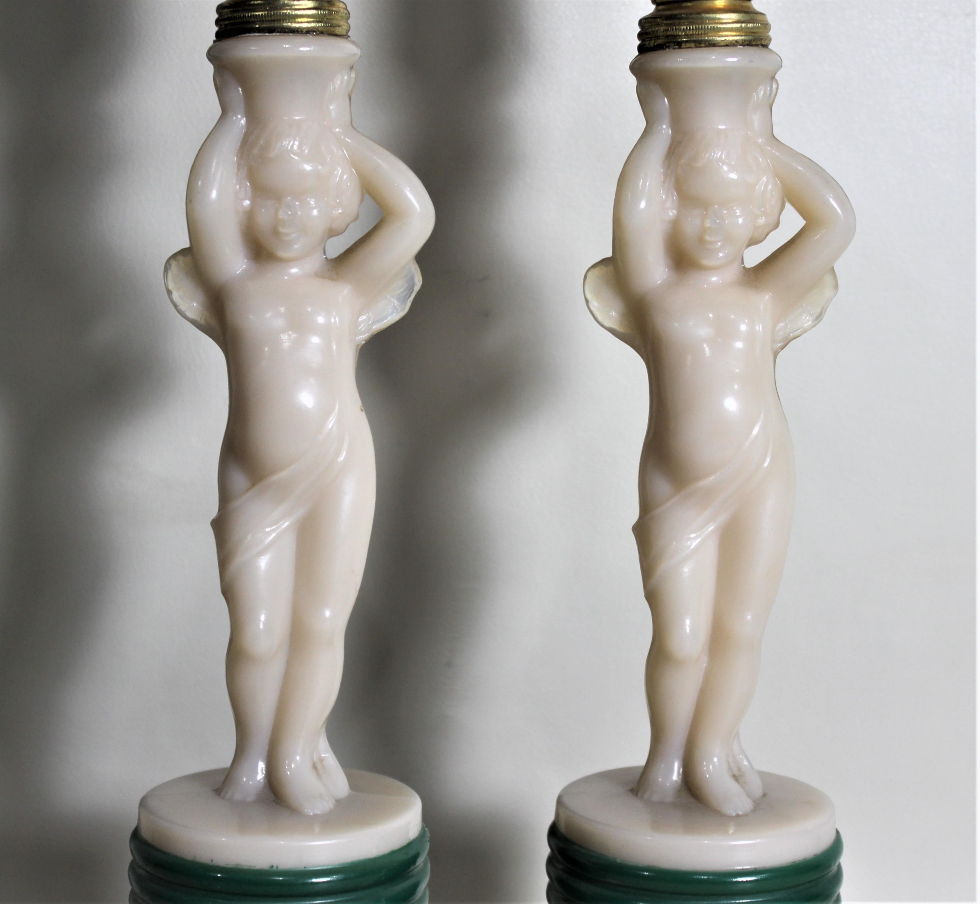 Molded Pair of Aladdin Art Deco Figural Winged Cherub Glass Table or Boudoir Lamps For Sale