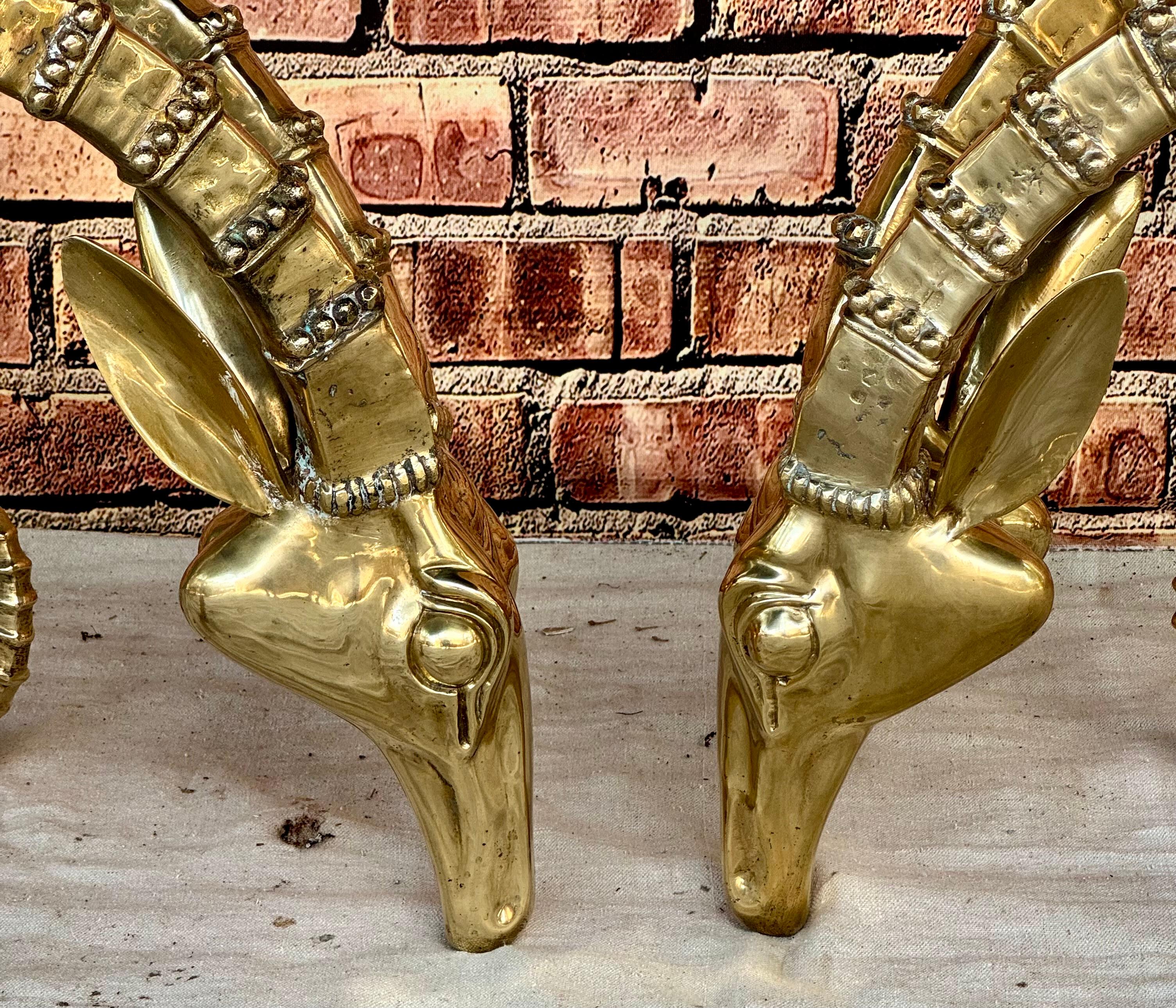  Pair of 20th century modernist coffee table bases in the style of Alain Chervet, each crafted from gilt metal and depicting an ibex head featuring long, curling horns. Highly decorative and very impactful for any home. 

