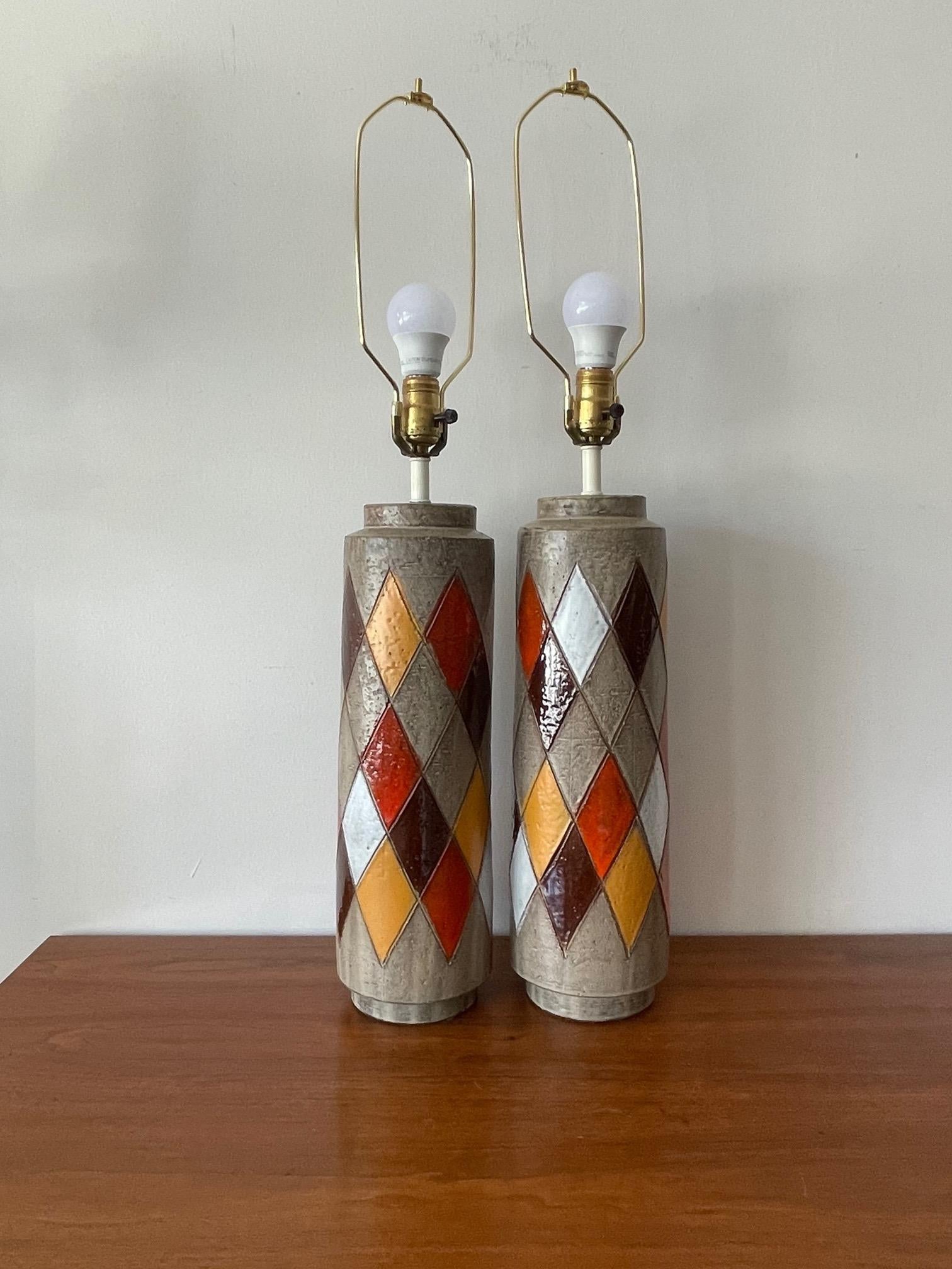A great pair of Also Londi for Bitossi ceramic lamps with a harlequin pattern decoration. The lamps are large with ceramic bases approx. 17.5