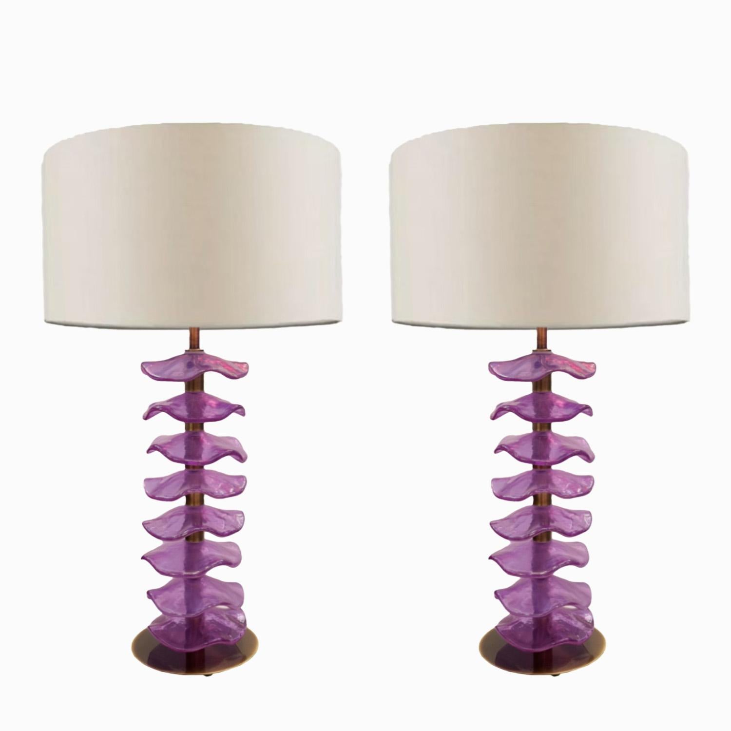 

Whimsical petal table lamps in rich Alexandrite iridescent glass. Strung like leaves on stalk of antique brass, the shimmering petals turn deep hues of purple and pink as light reflects off their wavy iridescent surface. Elegant  but playful, they