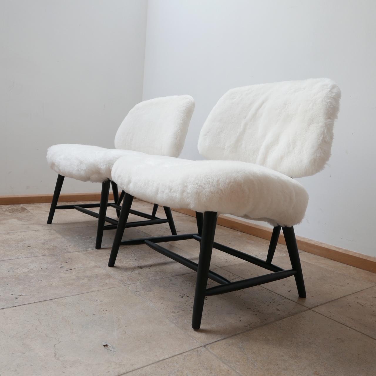 A lounge chair by Alf Svensson. 

'TeVE' model for Studio Ljungs Industrier AB Malmö.

Sweden, c1950s. 

Blackended/stained Beech wood, brass parts, re-upholstered in white sheepskin. 

Perfect for a living room or bedroom.

Dimensions: 65