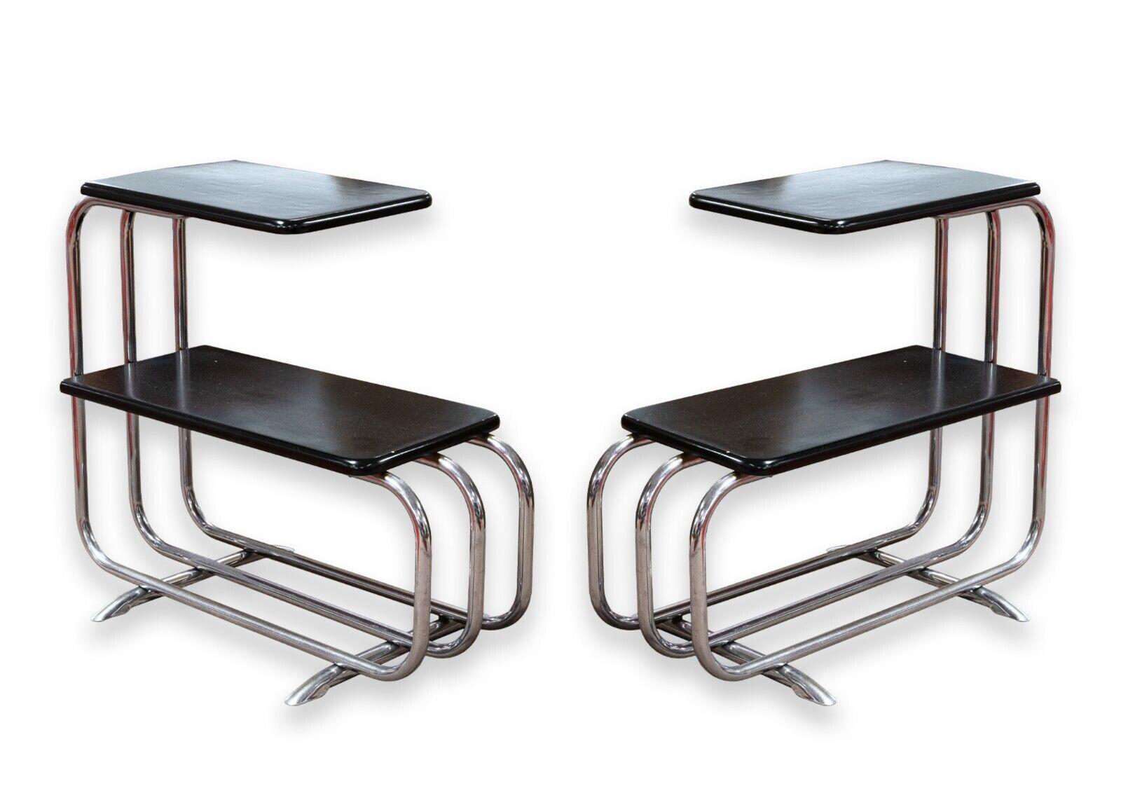 A pair of Alfons Bach for Lloyd Manufacturing Co side end tables. A truly stunning set of vintage art deco side end tables. These table feature a two tier design, white a tubular chrome frame, and black lacquered wood table tops. These tables were