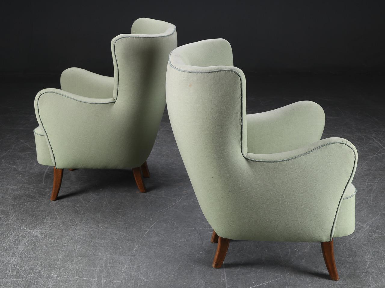 Pair of Danish Modern Alfred Christensen armchairs, with upholstered arms, upholstered in a grey wool fabric, good form, buttoned backs and very comfortable.