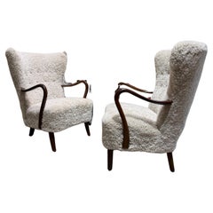 Pair of Alfred Christensen armchairs in sheepskin Denmark 1950