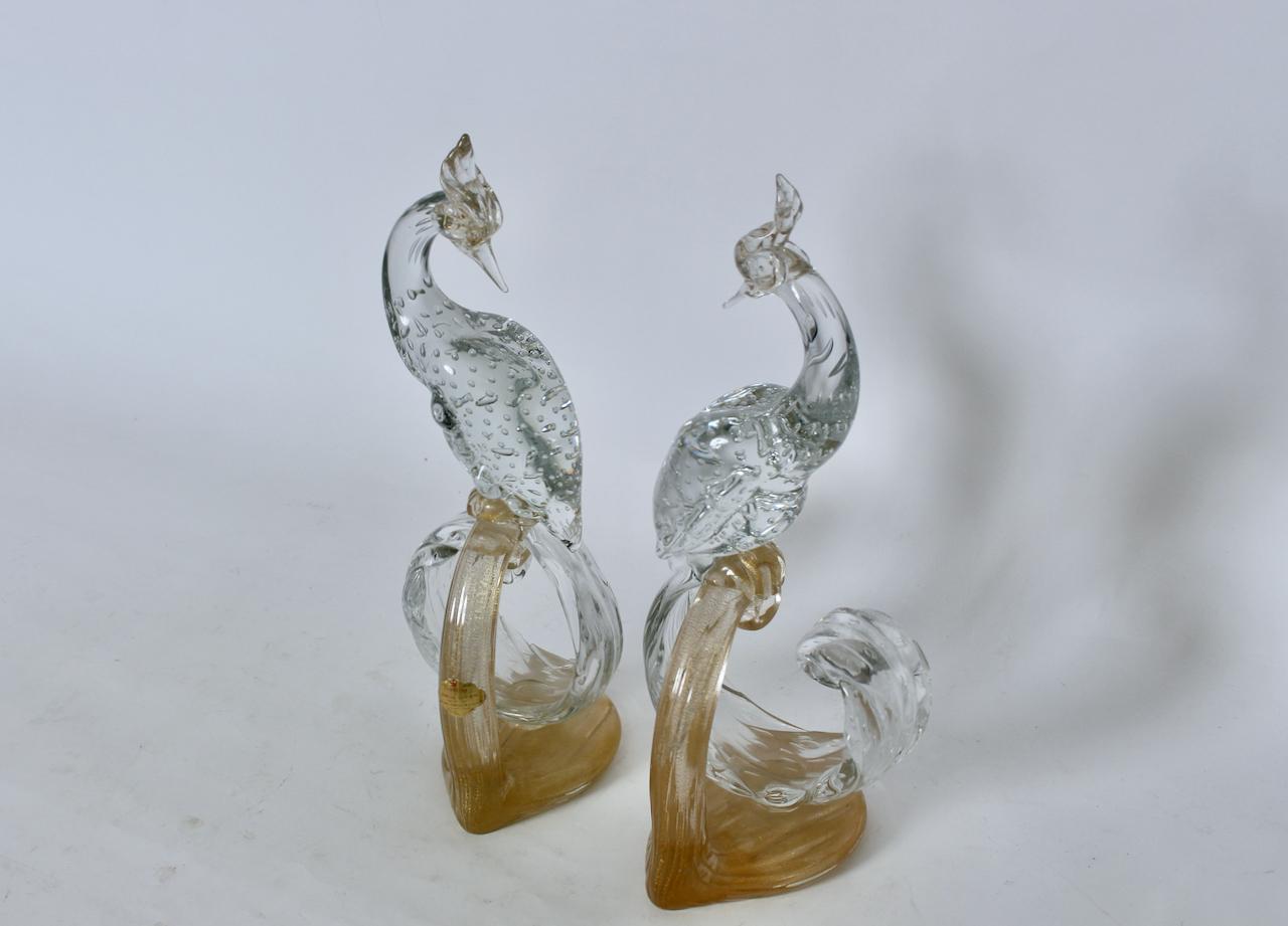 Alfredo Barbini hand blown Venetian Murano Clear & Gold flecked Glass sculptures, Featuring handcrafted clear and controlled bubbled Murano Art Glass birds, with clear crests, Head with Gold inclusions, pointed beaks, detailed with clear long