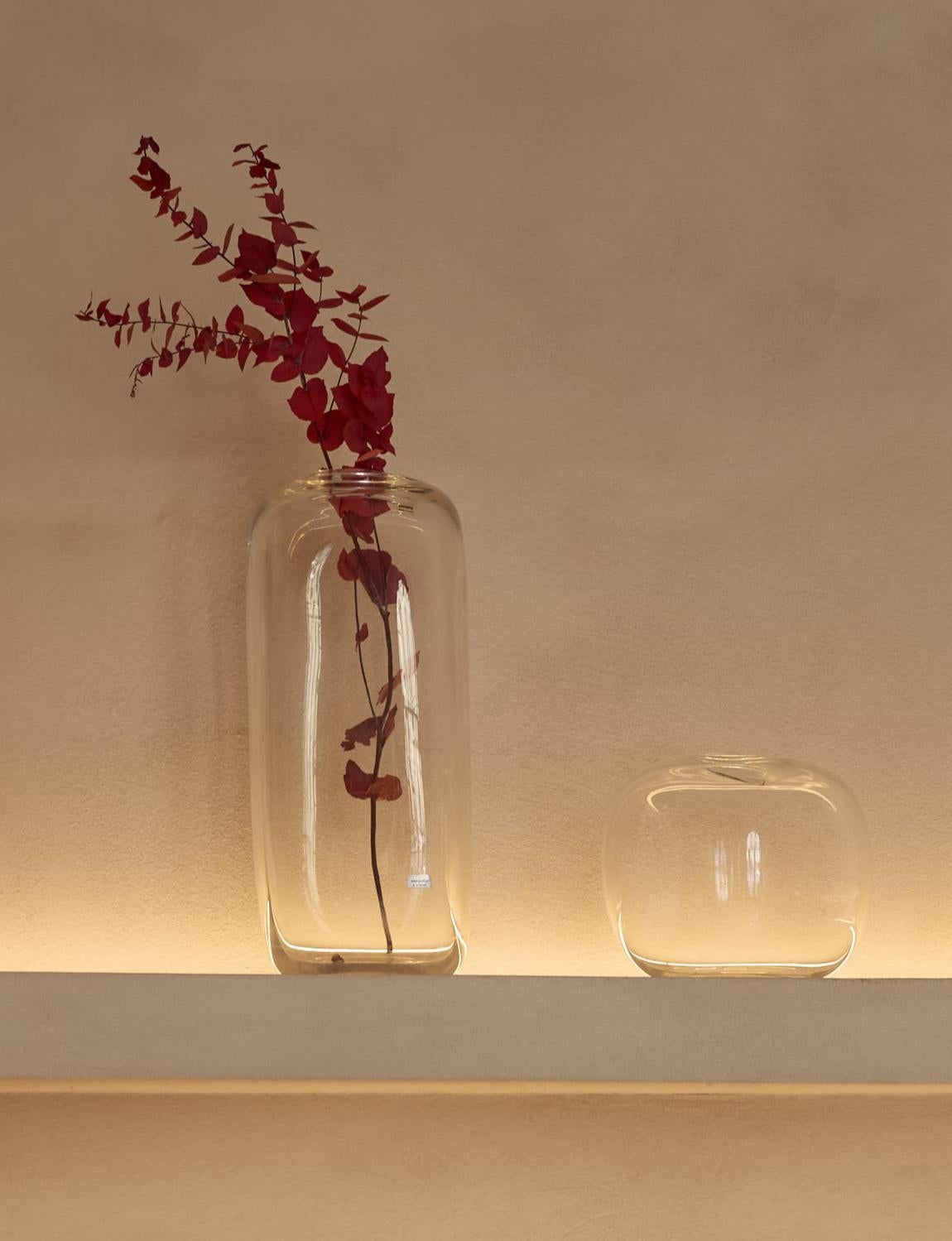 I am a big fan of the Alfredo Barbini Cube series - the collection of Murano glass works characterized by his hand-blown cubic shapes, each with their irregular openings. These two vases - one tall and one cubic - date from around 1972. The tall