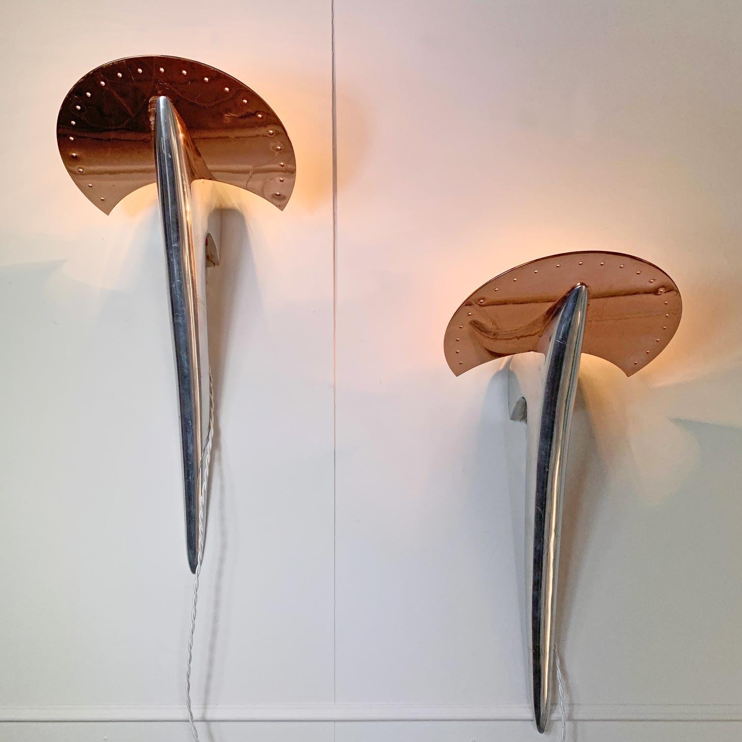 An incredible pair of wall lights in chrome and copper, these were commissioned by the New York Museum of modern art in the 1980’s and were designed by Joan Auger, manufactured by Taller Uno.

The stunning Art Deco inspired futuristic design, with