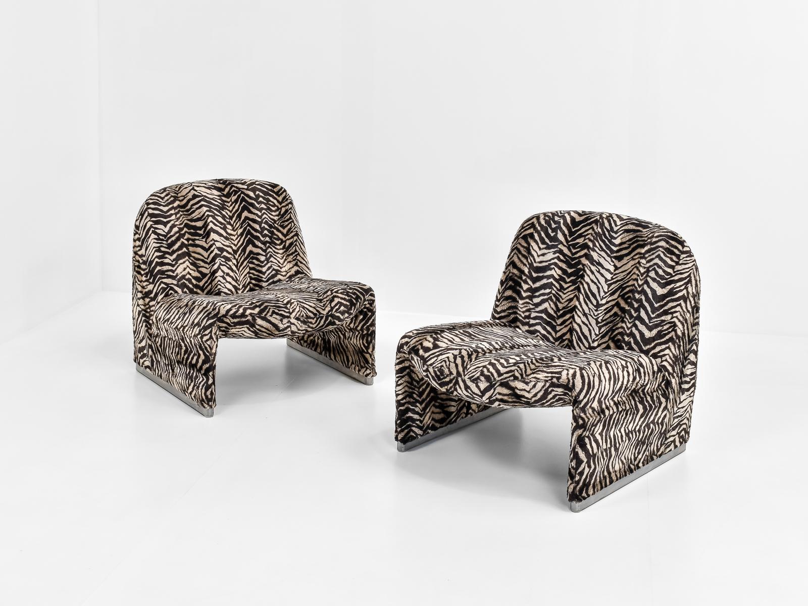 The chair was designed by Giancarlo Piretti for Anonima Castelli in Italy early 1970s. 

These chairs once belonged to the city of Liège, Belgium. 

The upholstery is in a fluffy, zebra-print, which makes them a real funky eye-catcher. Unique