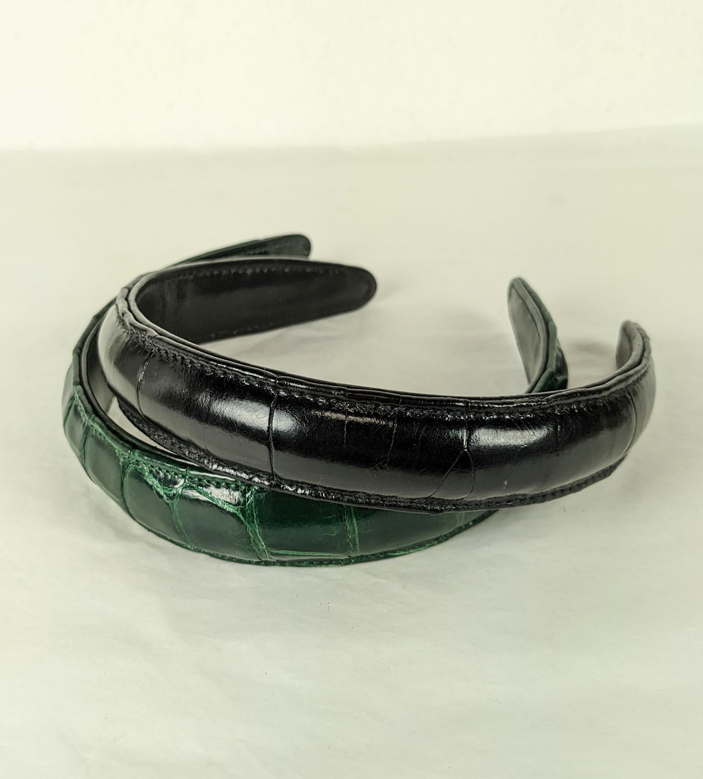 Pair of Alligator Hair Bands lined in leather, retailed by Saks Fifth Ave, 1980's. Deep green and black colorations, slightly padded and topstitched. 14.5