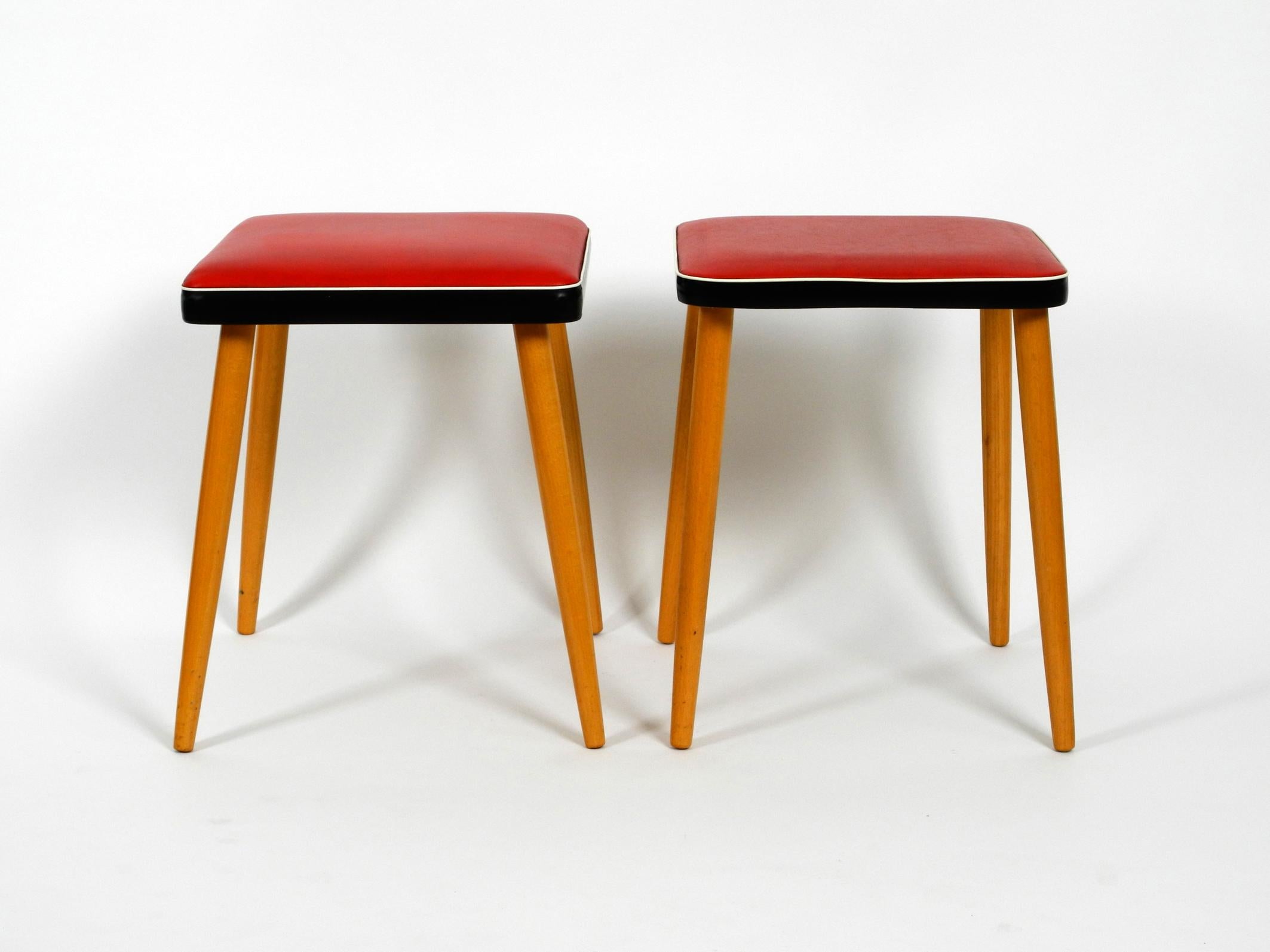 German Pair of Almost Mint Midcentury Wooden Stools with Red Faux Leather Cover in Red