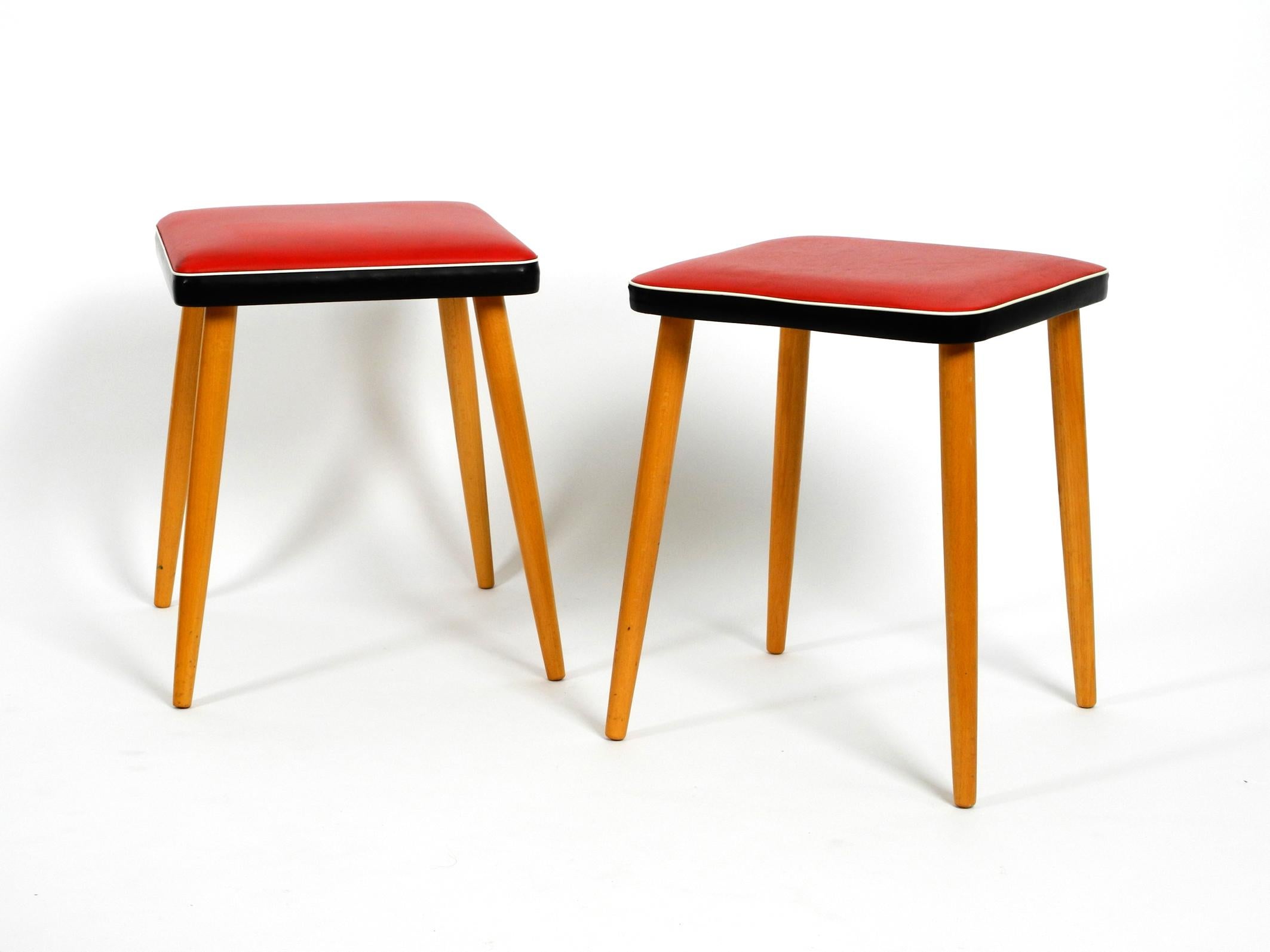 Mid-20th Century Pair of Almost Mint Midcentury Wooden Stools with Red Faux Leather Cover in Red