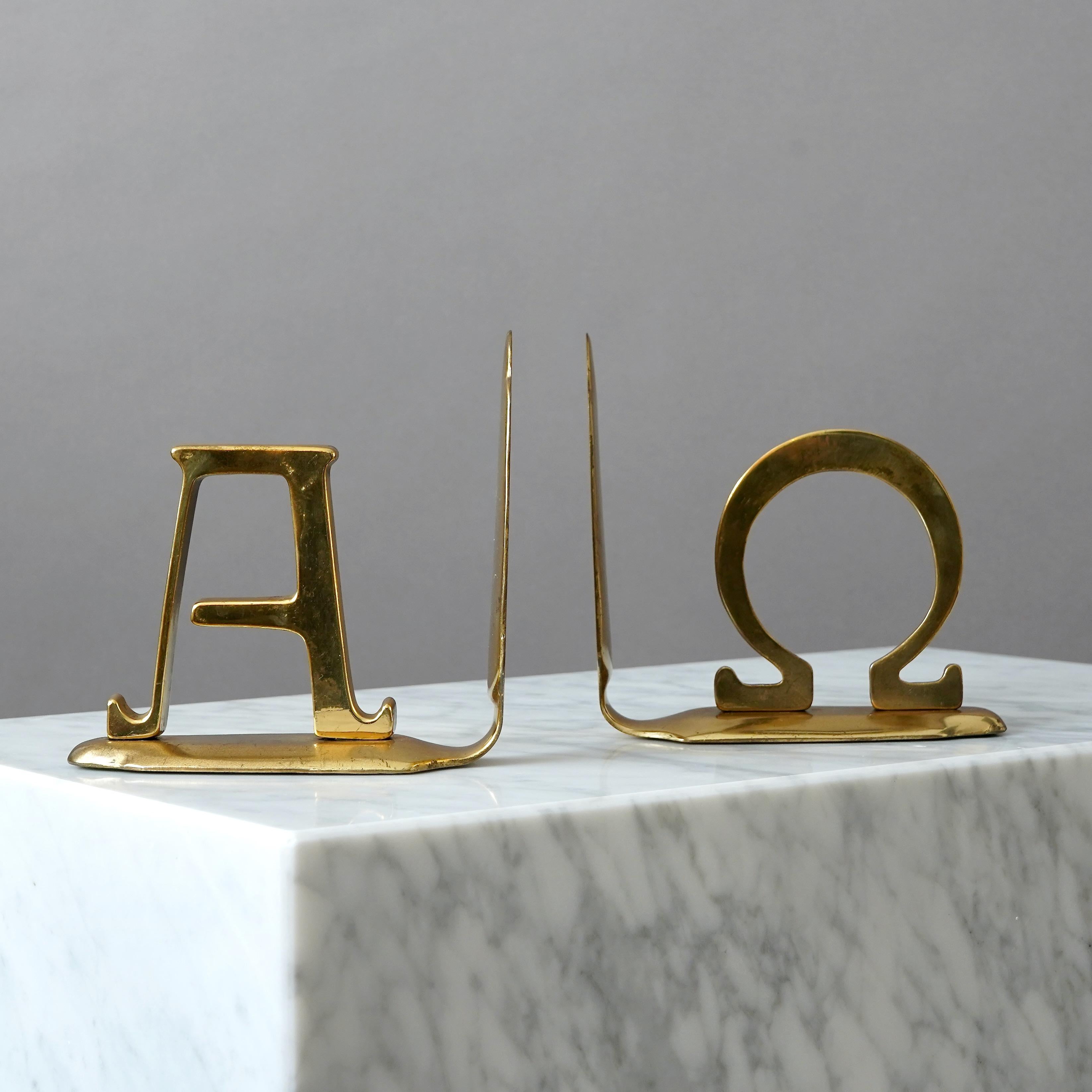 A pair of beautiful brass book ends with great patina. 
The Greek letters Alpha and Omega (beginning and end).
Produced in Germany, 1960s.
Great condition. 