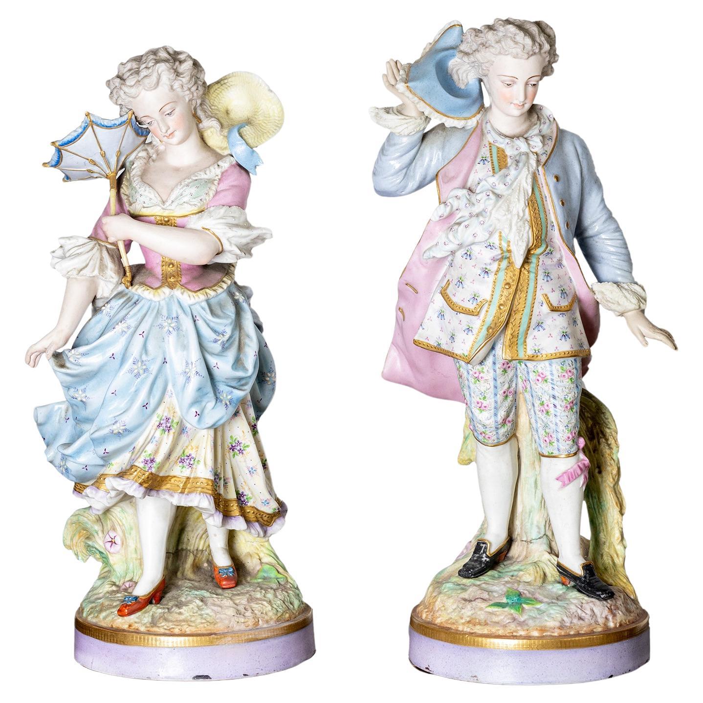 Coppia di statuette in porcellana di Limoges di Alpinien Margaine, XIX secolo