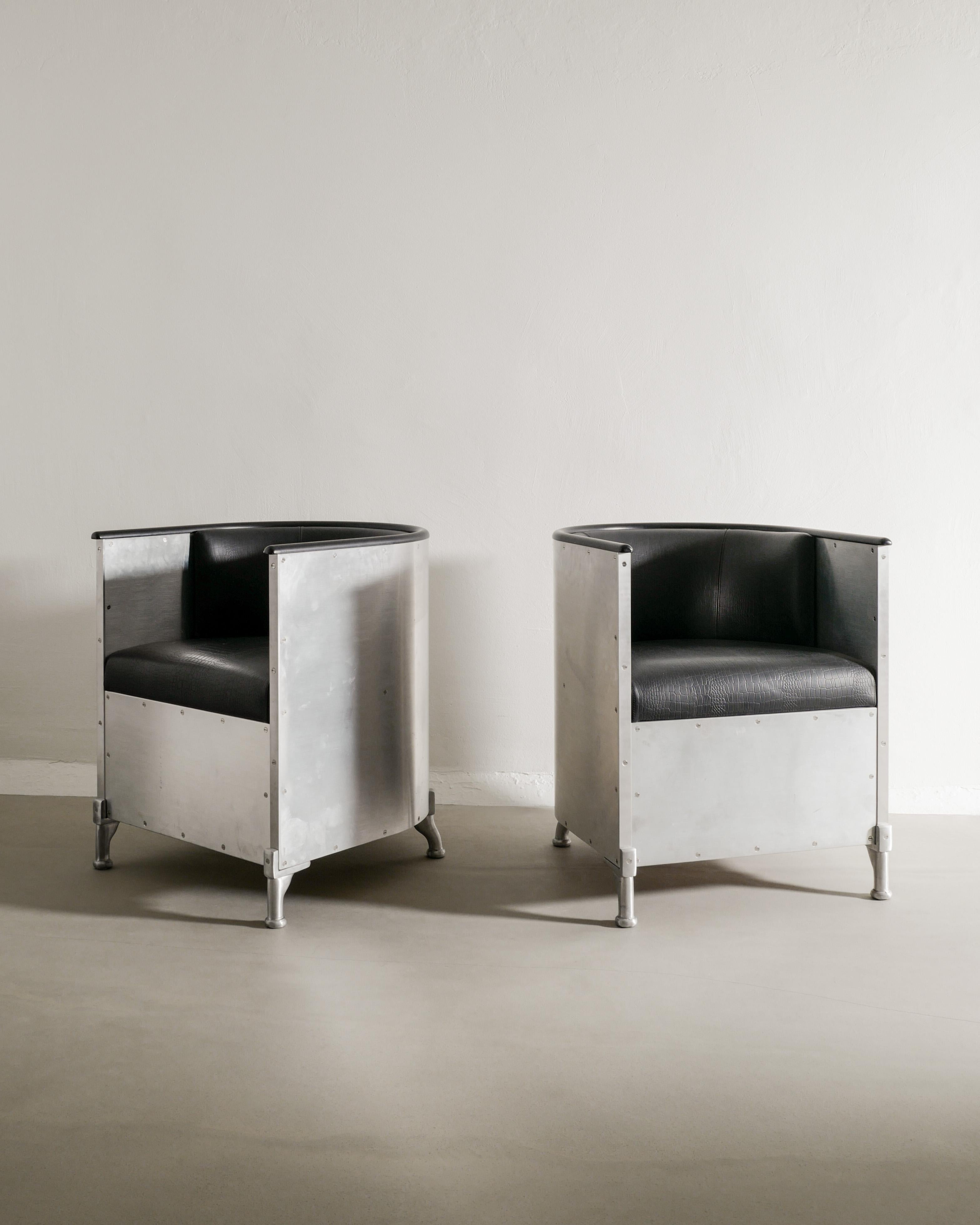 Very rare pair of armchairs by Mats Theselius in aluminum and black croco leathers produced in a limited serie of only 99 chairs by Källemo, 1990s. In good original and matching condition. The chairs are numbered 3 & 4 in this serie. 

Dimensions: