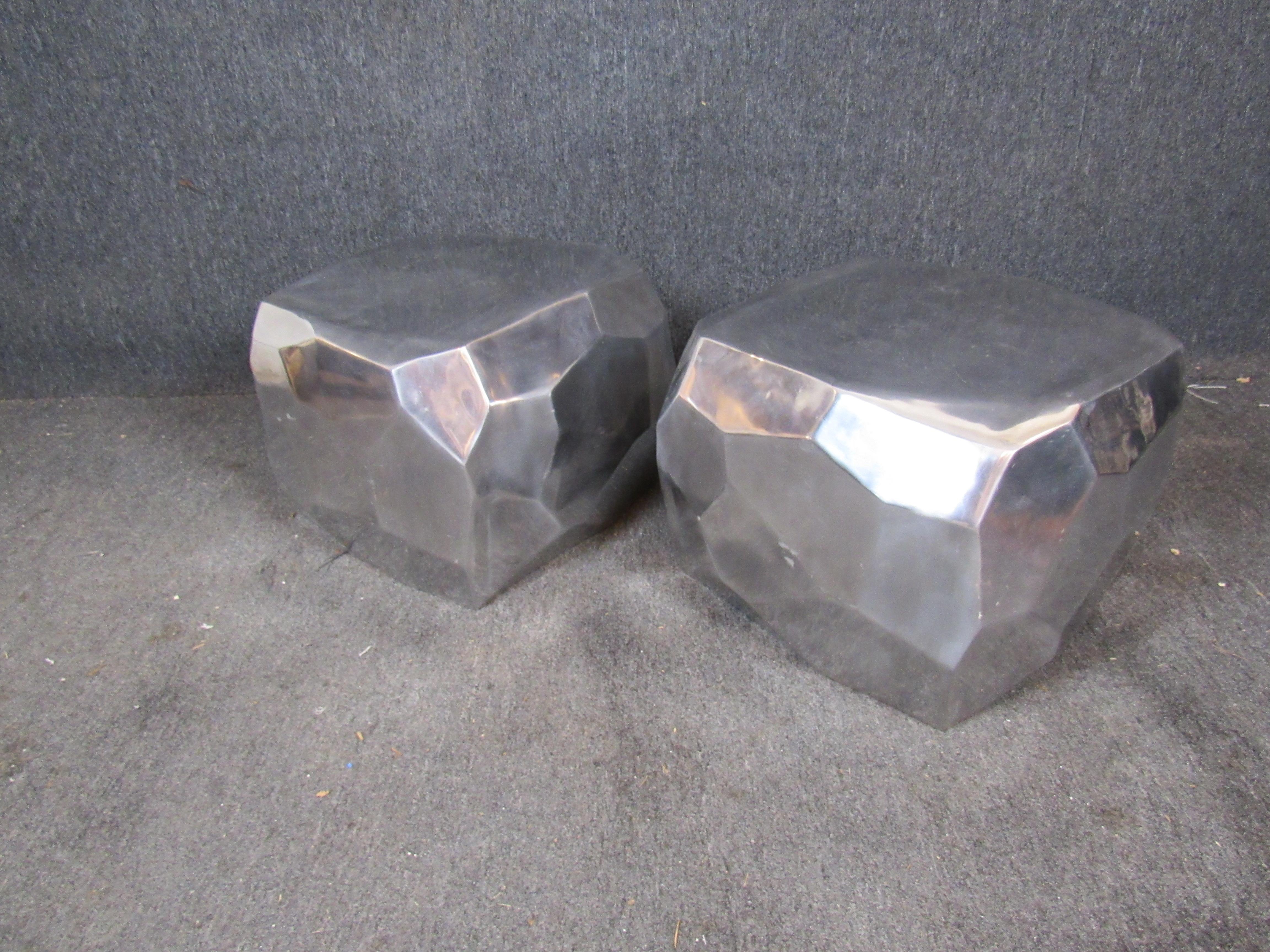 Whether in the stone age or the space age, these funky polished aluminum side tables are sure to make a statement! Featuring a hollow, asymmetrical form and a beautiful mirror like finish- these would also work great as unique stools or ottomans, or
