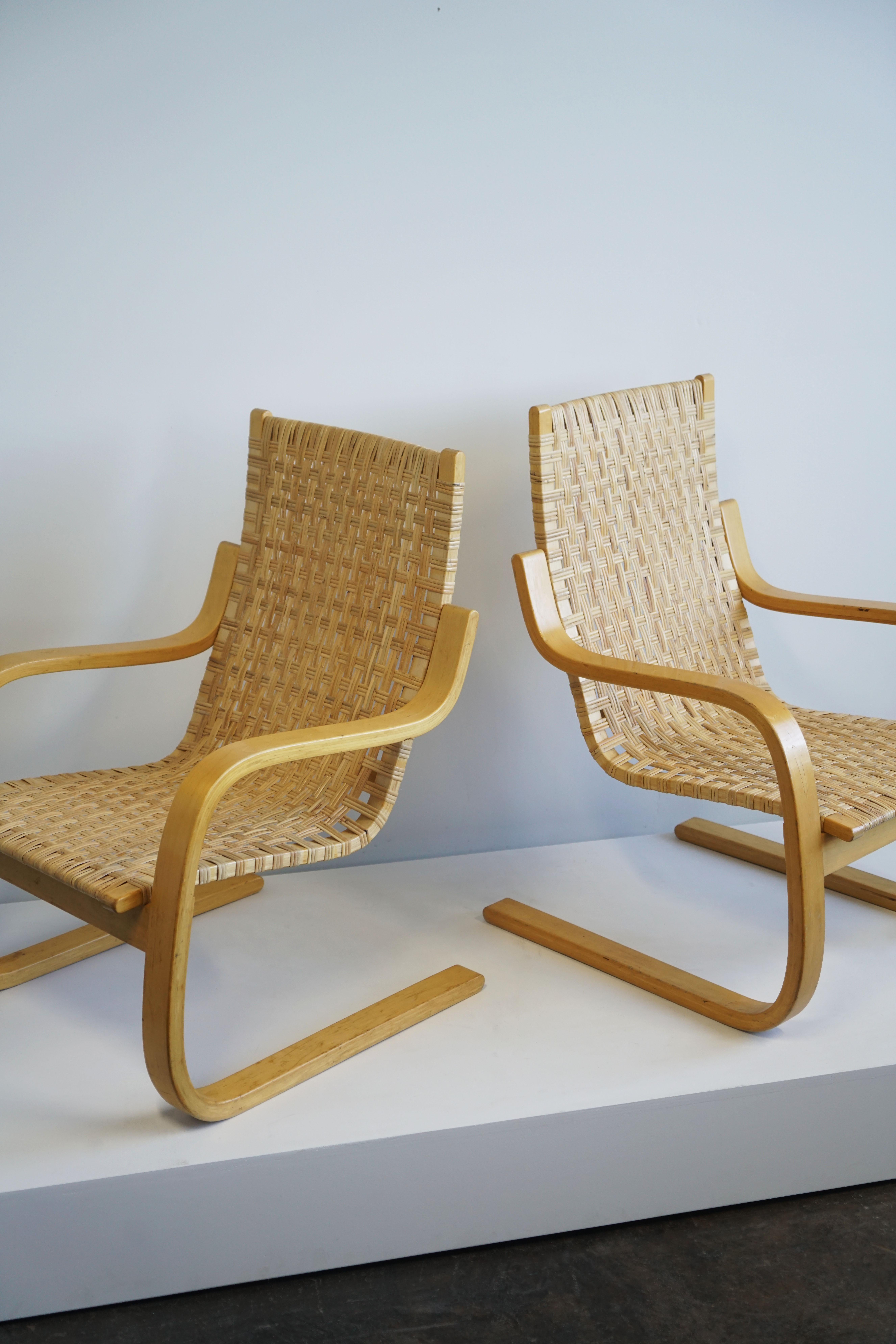Finnish Pair of Alvar Aalto Cantilever Chairs Model 406 by Artek in Birch Cane Webbing For Sale