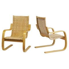 Pair of Alvar Aalto Cantilever Chairs Model 406 by Artek in Birch Cane Webbing