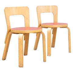 Pair of Alvar Aalto chair N65 by Artek with red linoleum seats c.1950s