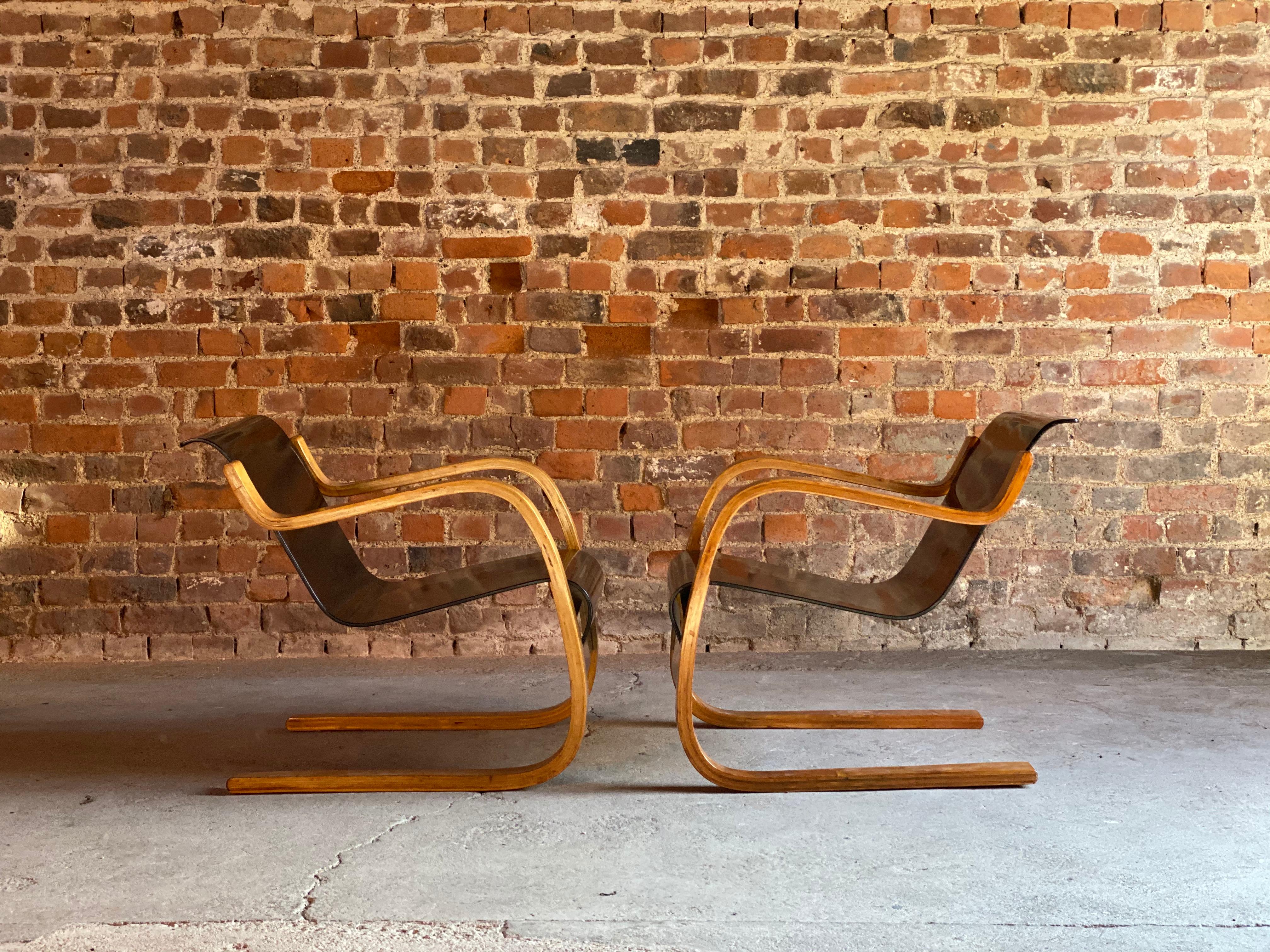 Rare pair of Alvar Aalto Model 31 armchairs for Finmar, Finland, circa 1930s 

Alvar Aalto pair of Model 31 laminated birch and plywood cantilever armchairs circa 1930s, with blackened seat and back. Designed by Alvar Aalto for Finmar. with