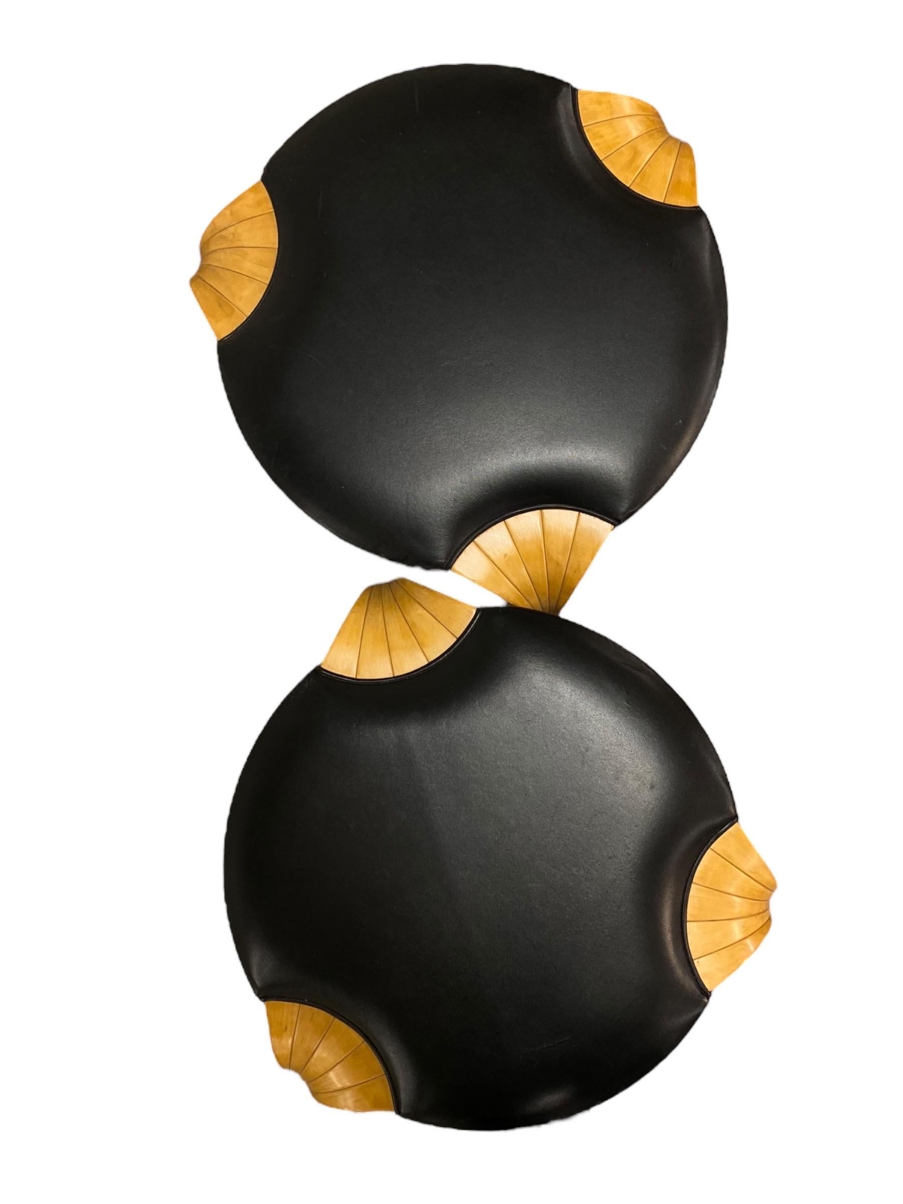 A pair of beautiful model X600 stools designed by Alvar Aalto for Artek in the 1960s in Finland. Even though simple, these stools come with great quality and attention to detail. The less common X-leg with the leather padding brings plain beauty.