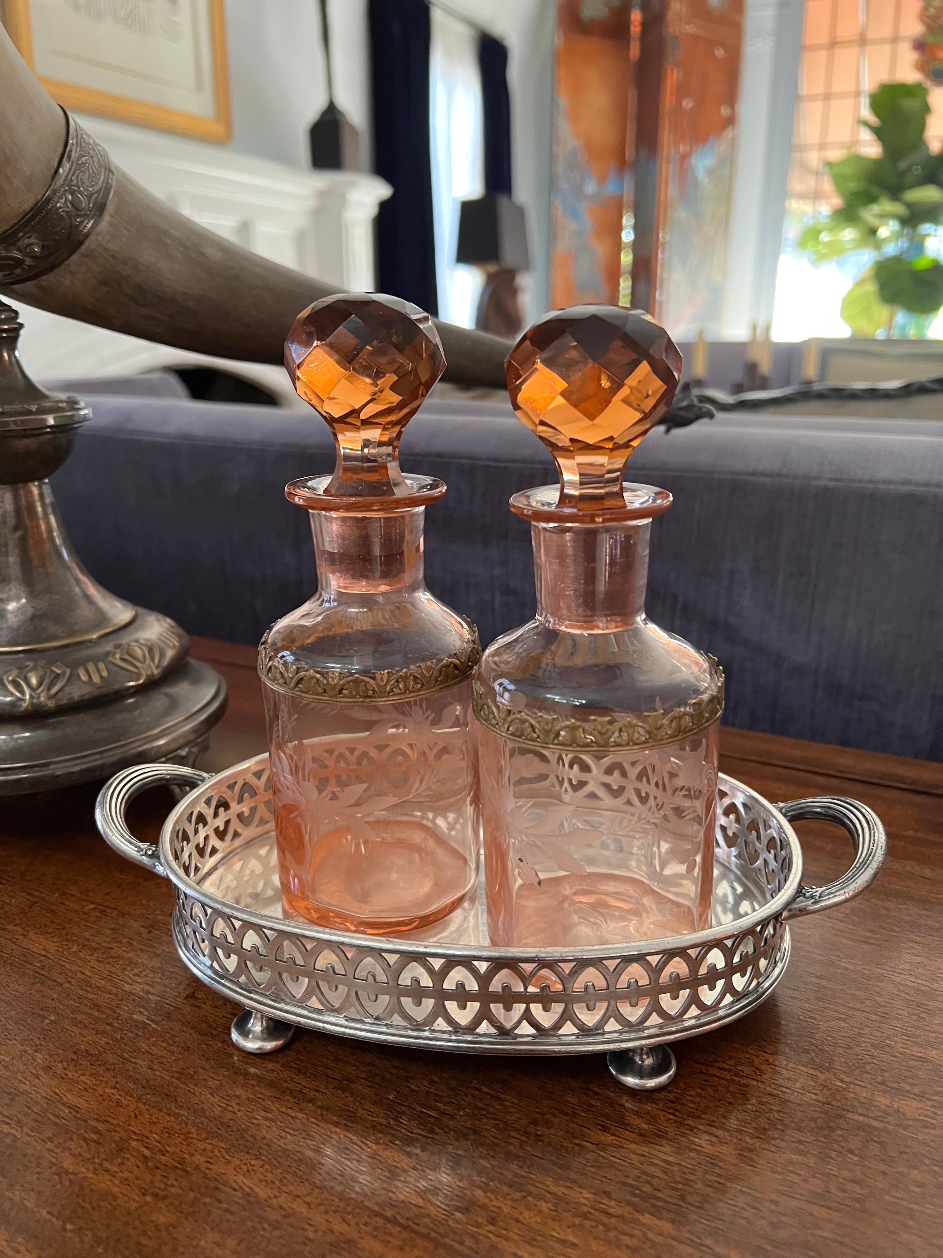 Pair of Amber Cut Crystal Art Deco, art Nouveau Decanters. The pair are unique in color and size a compliment to the vanity for perfumes, scents, for the bath or even mouthwash (perhaps hers and hers). Likely Art Deco or 

Wonderfully decorative