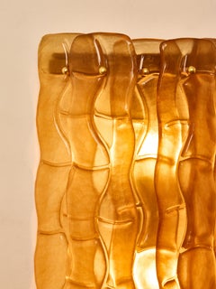 Pair of "Amber" wall sconces by Studio Glustin