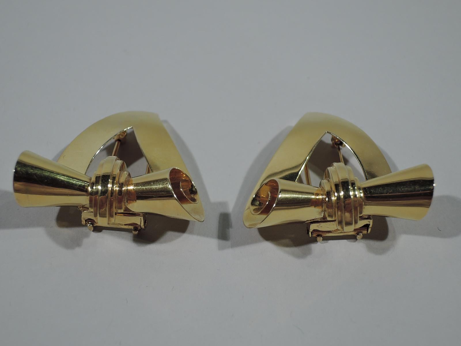 Pair of Retro 14K gold pins. Each: Open and shaped triangle with strapwork scroll bisected by stepped arch. Fluid and snazzy. United States, ca 1940. Hallmarked. The original Tiffany stamp was lost during conversion.
