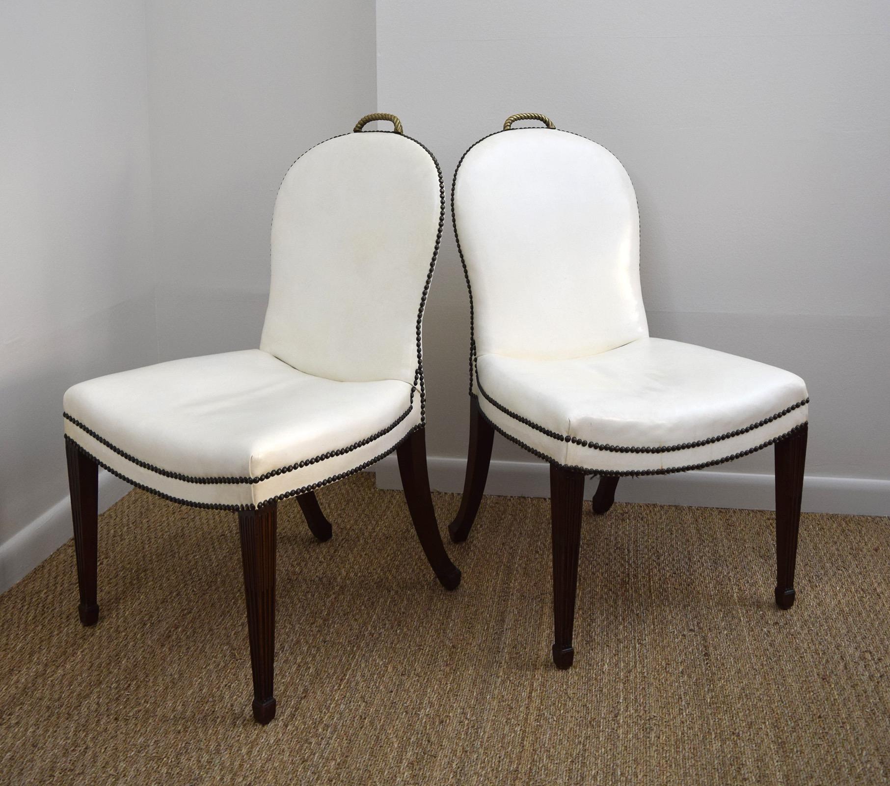These over-scaled chairs were said to have been designed by Chicago architect Sam Marx, but they were probably made by William Quigley, whose workshop and showroom supplied him with furniture. The sweeping lines of the back and seat, the white