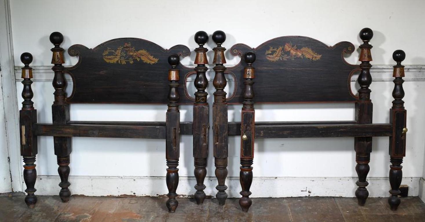 Pair of American Federal Grain Painted and Decorated Twin Cannonball Beds.  Most likely Maine. Circa 1830.  Retaining original paint decoration of the Federal Period

Mixed woods, maple and pine