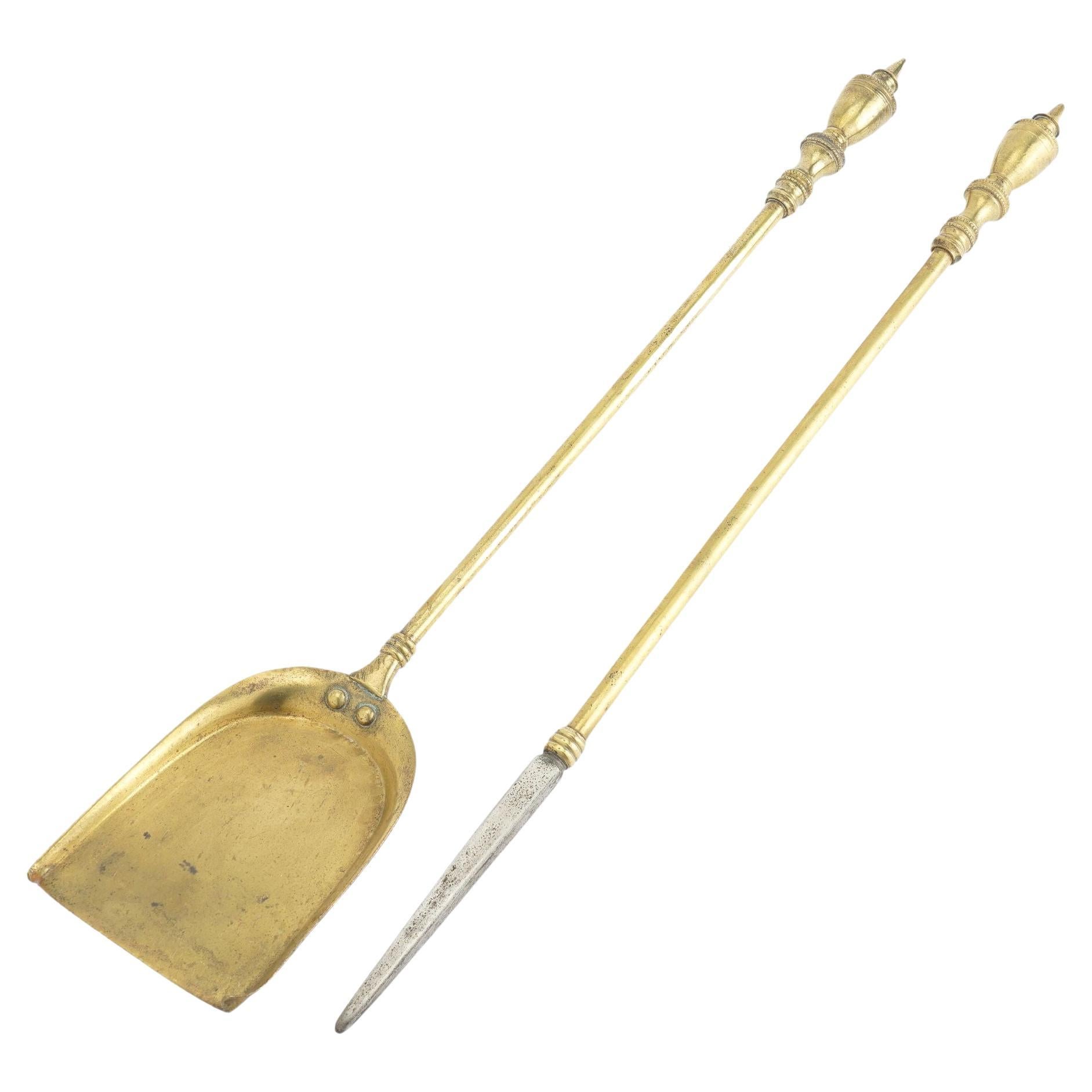 Pair of American Academic Revival brass fire tools, c. 1950 For Sale