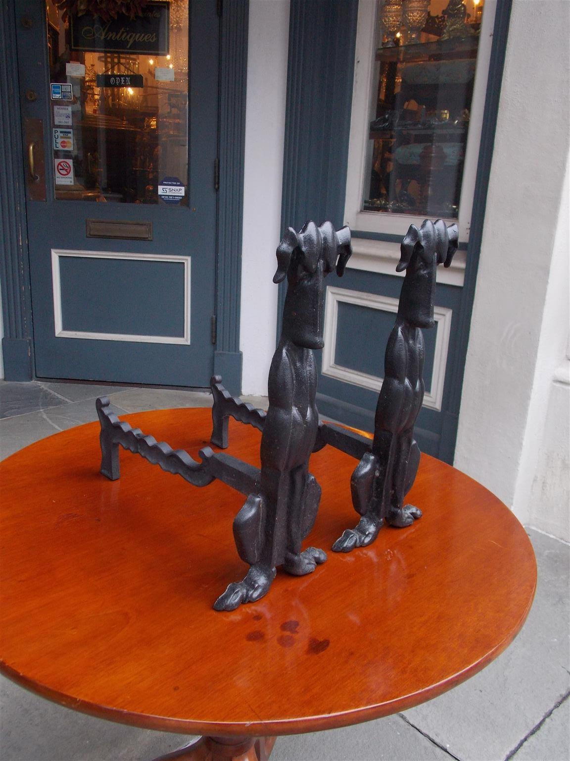 Pair of American Art Deco cast iron sporting dog andirons with the original rear scalloped removable legs, early 20th century.