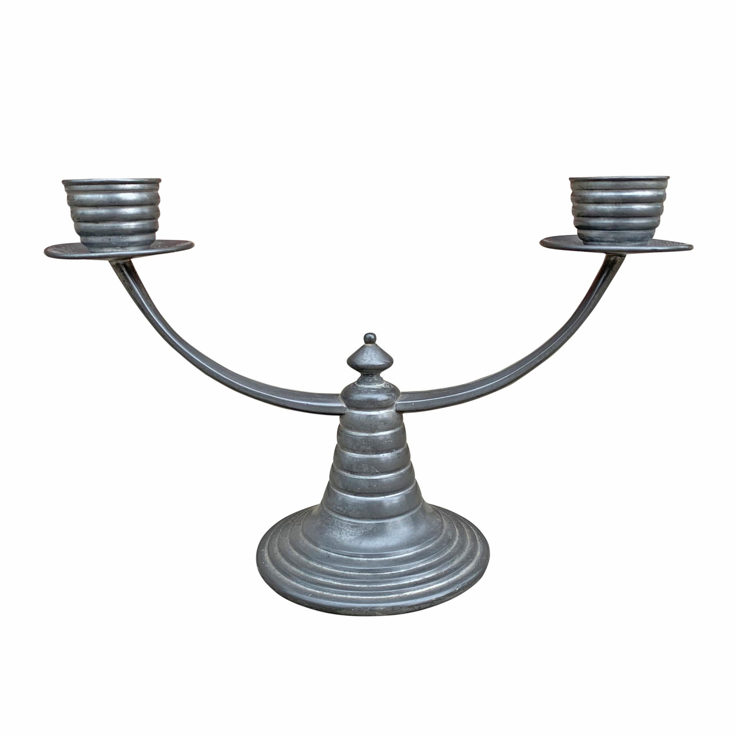 A fantastic pair of early 20th century American Art Deco pewter two-arm candelabra with a fun ribbed motif.