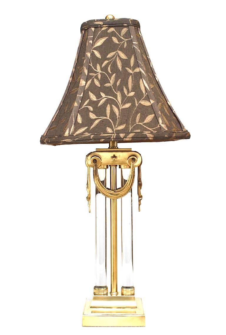 Pair of American Mid-Century brass & glass table lamps with swag hung capital above Paired glass cylinders (PRICED AS Pair).
