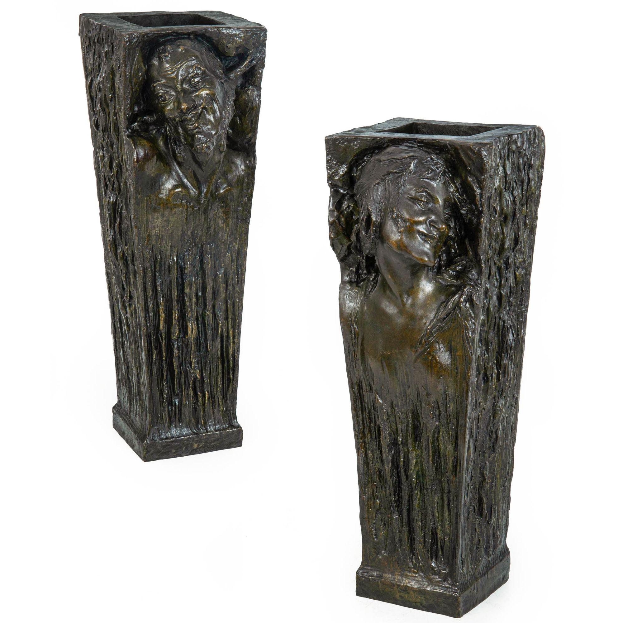 A PAIR OF ART NOUVEAU BRONZE VASES DEPICTING A SATYR AND MAENAD
Cast by Roman Bronze Works of New York  circa early 20th century
Item # 411SXU18A

A fabulous pair of vases with naturalistic and chaotic surface texture throughout the trapezoidal