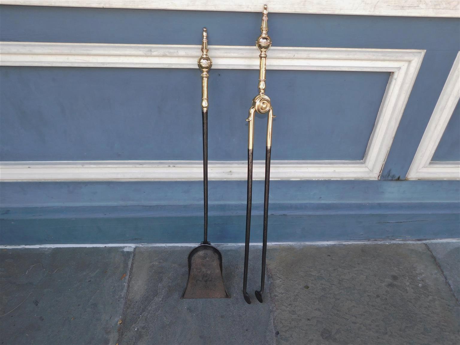 Pair of American brass and polished steel faceted steeple top finial fire tools with banded balls and decorative spurs. Early 19th century. Set consist of Tong and Shovel.
