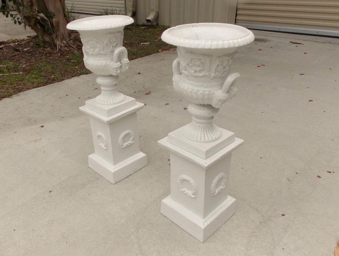 American Empire Pair of Cast Iron Floral Campana Garden Urns on Squared Plinths, Circa 1890