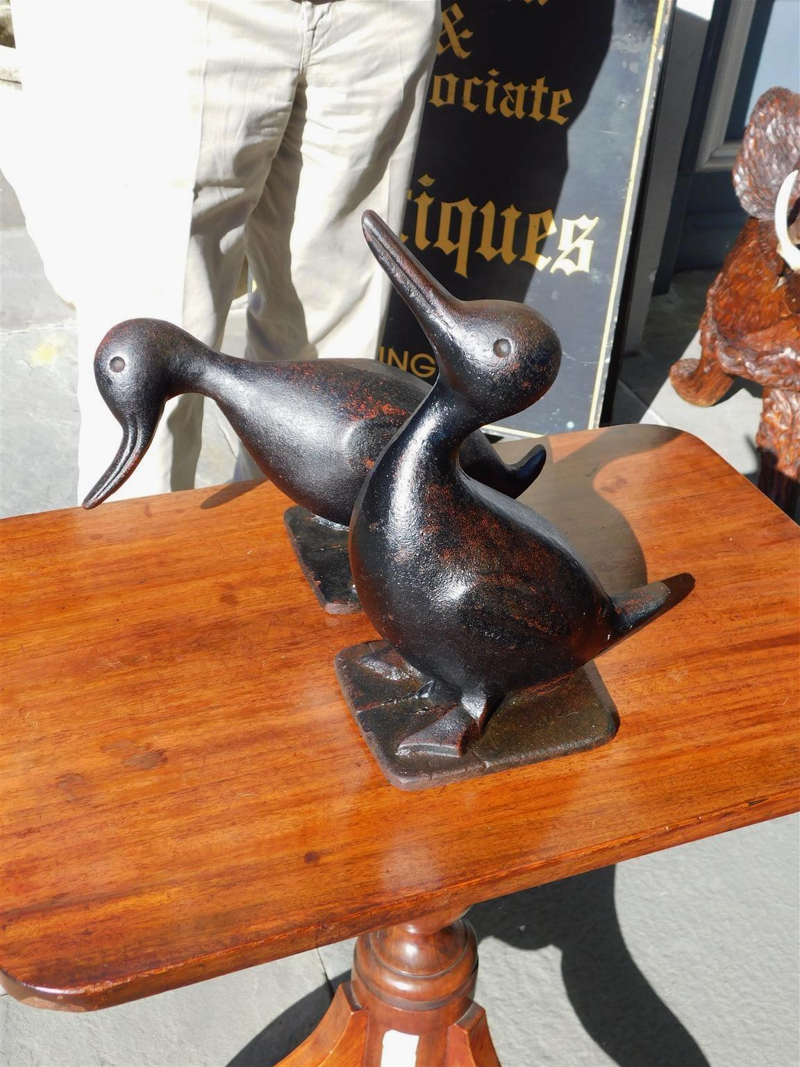 Late 19th Century Pair of American Cast Iron Hand Painted Preening Ducks on Squared Base, C 1880 For Sale