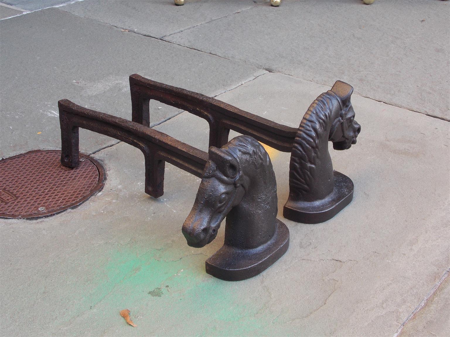 Pair of American cast iron horse head andirons with the original rear dog legs. Mid 19th century.
