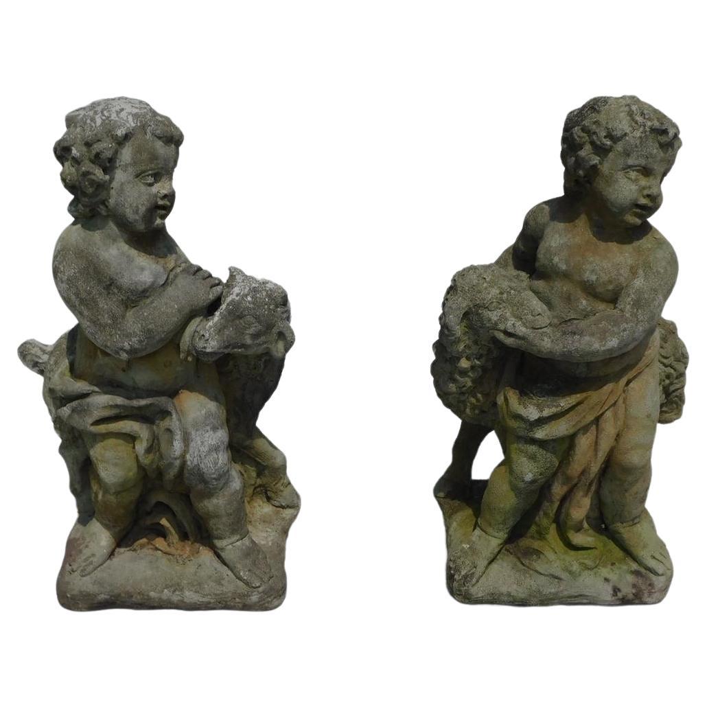 Pair of American Cast Stone Figural Boy & Girl Holding Lambs on Plinths, C. 1880 For Sale