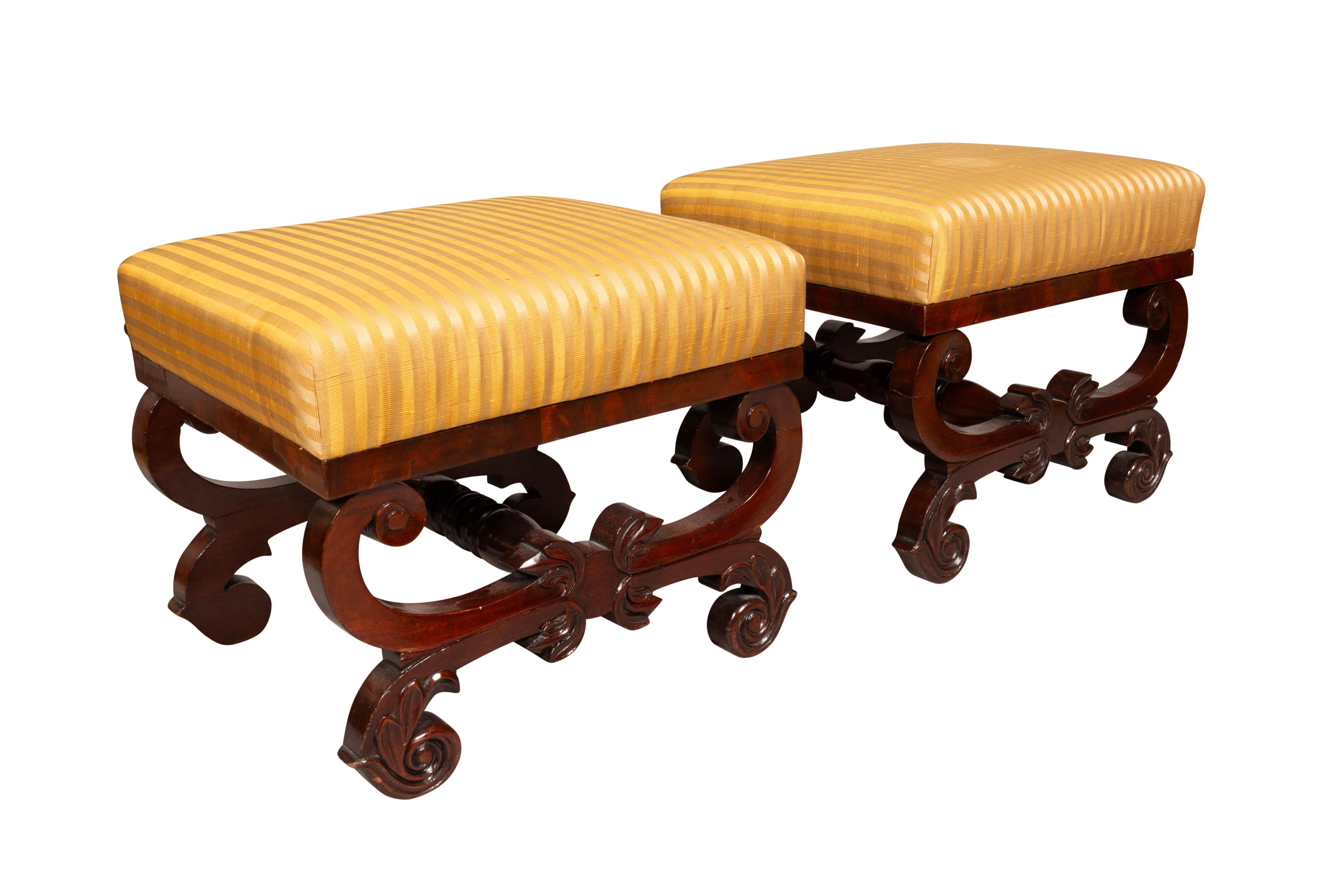 Rectangular upholstered seat raised on a reverse scroll carved base. Both sides finished.