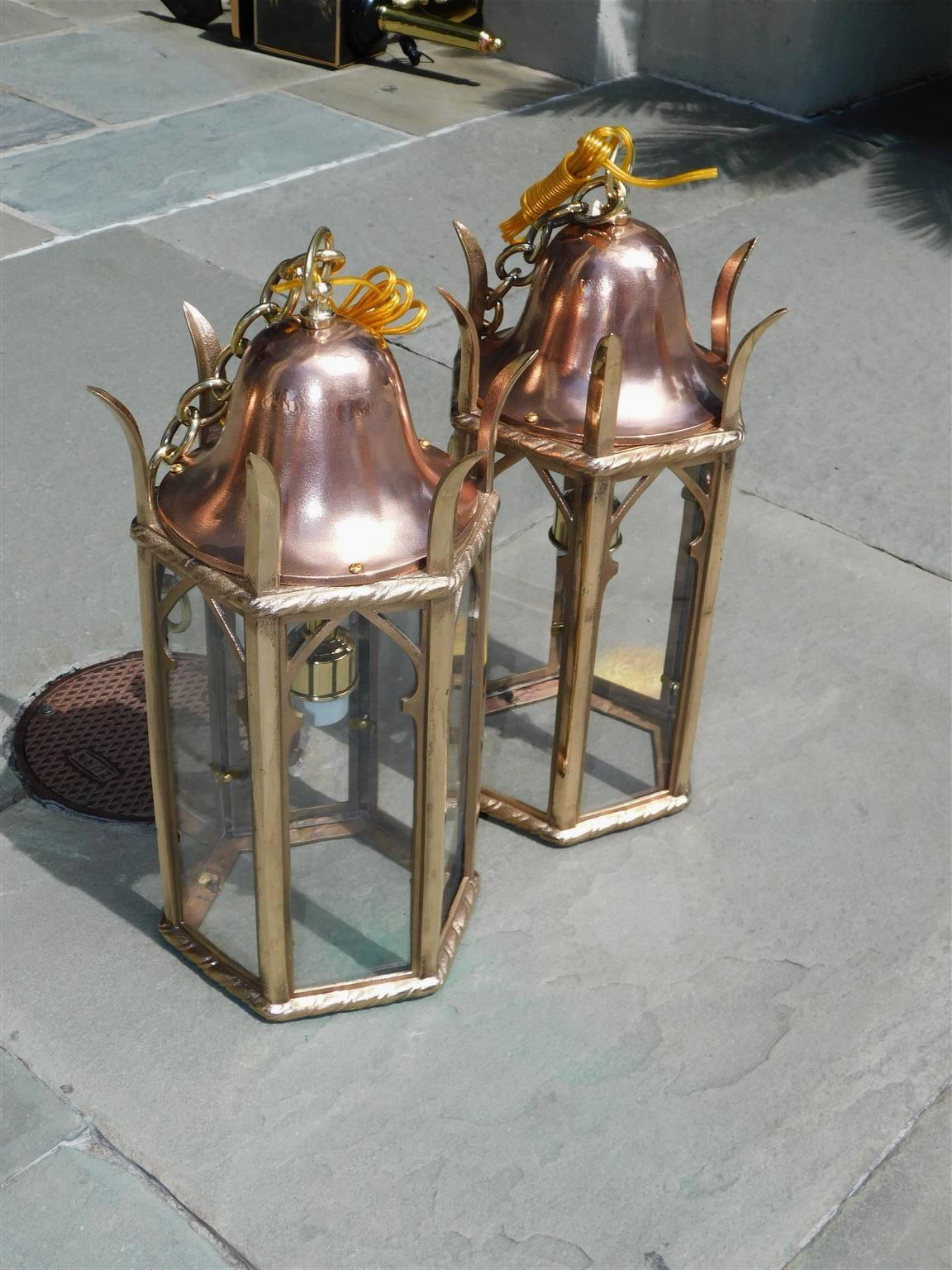 Pair of American dome finial copper and brass decorative hanging paneled glass hall lanterns. Originally gas and have been electrified with single interior socket. Mid 19th century.