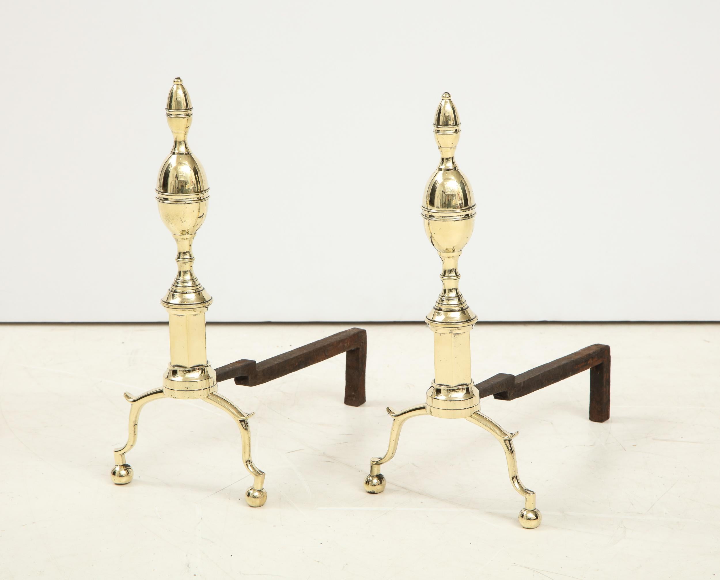 Good pair of American double lemon andirons, having beaded bands around both lemon finials, with turned collars over octagonal shafts, standing on arched legs with spurred knees and ball feet.