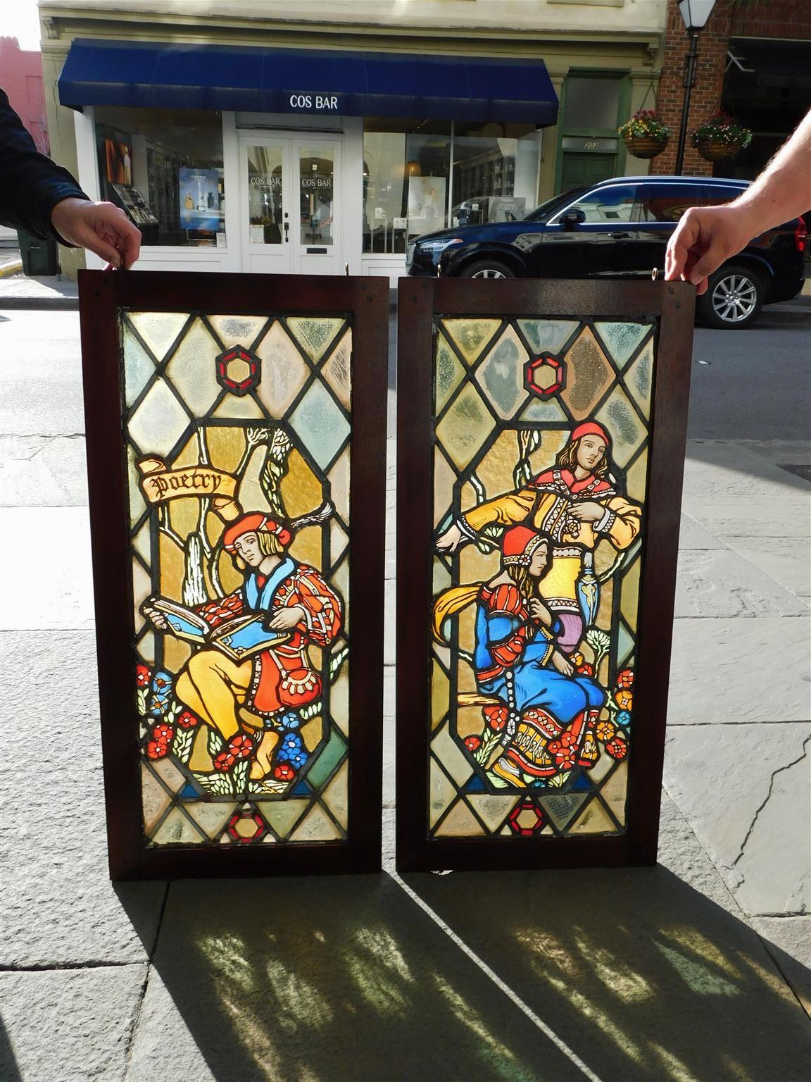 Pair of American Figural leaded stained glass windows in mahogany frames, 