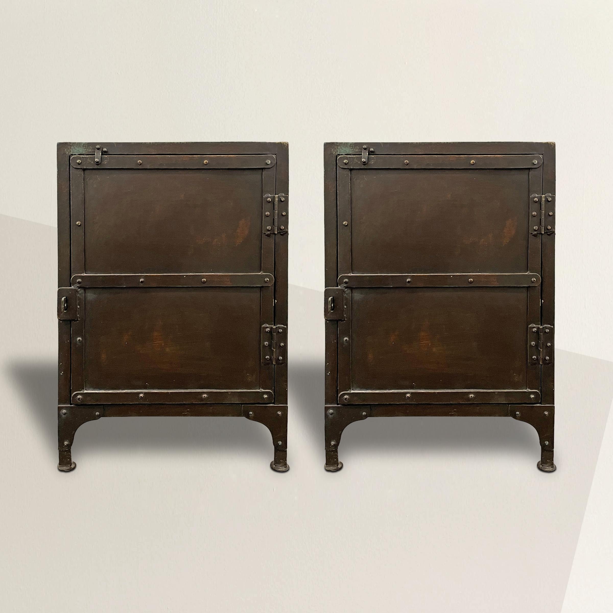 A wonderful pair of American 20th century Industrial steel cabinets, each with a door and a shelf inside. The perfect pair of nightstands or end tables!